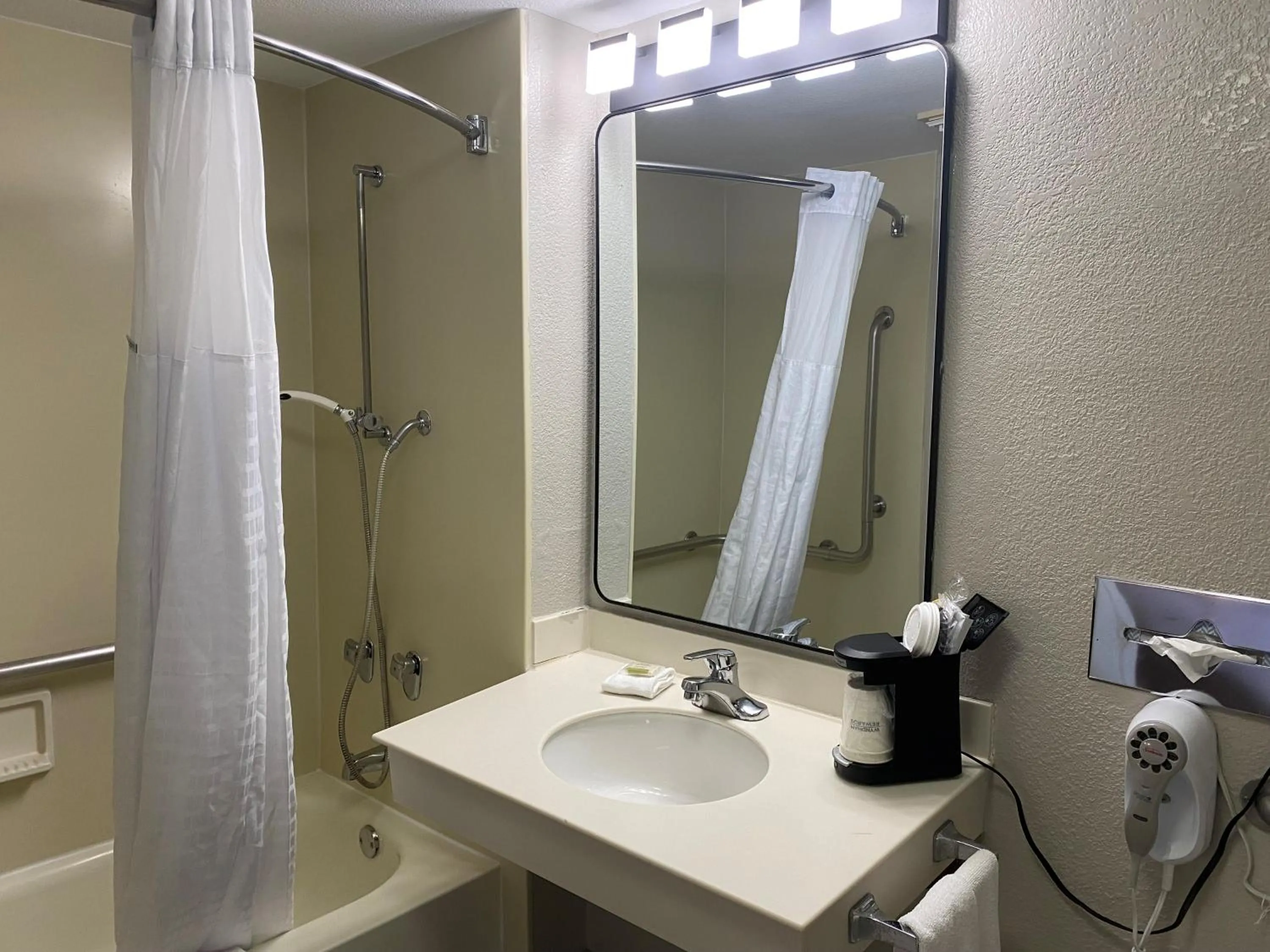 Bathroom in Days Inn & Suites by Wyndham Arlington Heights