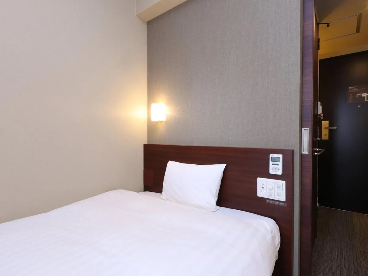 Bed in Dormy Inn Himeji Natural Hot Spring