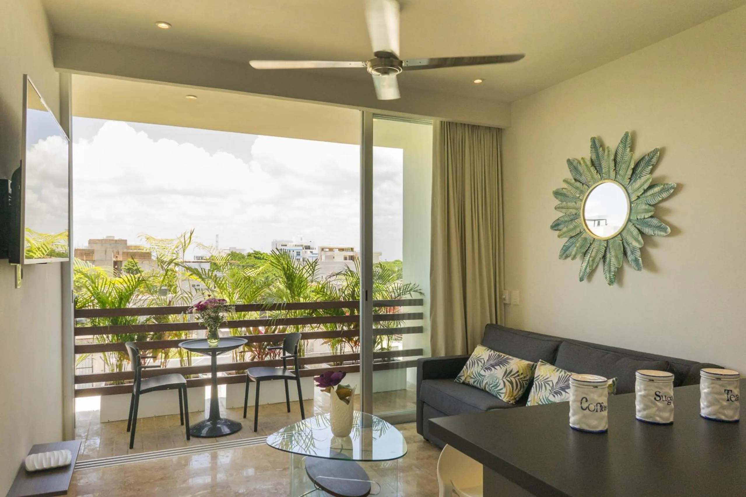 Communal lounge/ TV room in Tropic Playa Apartments
