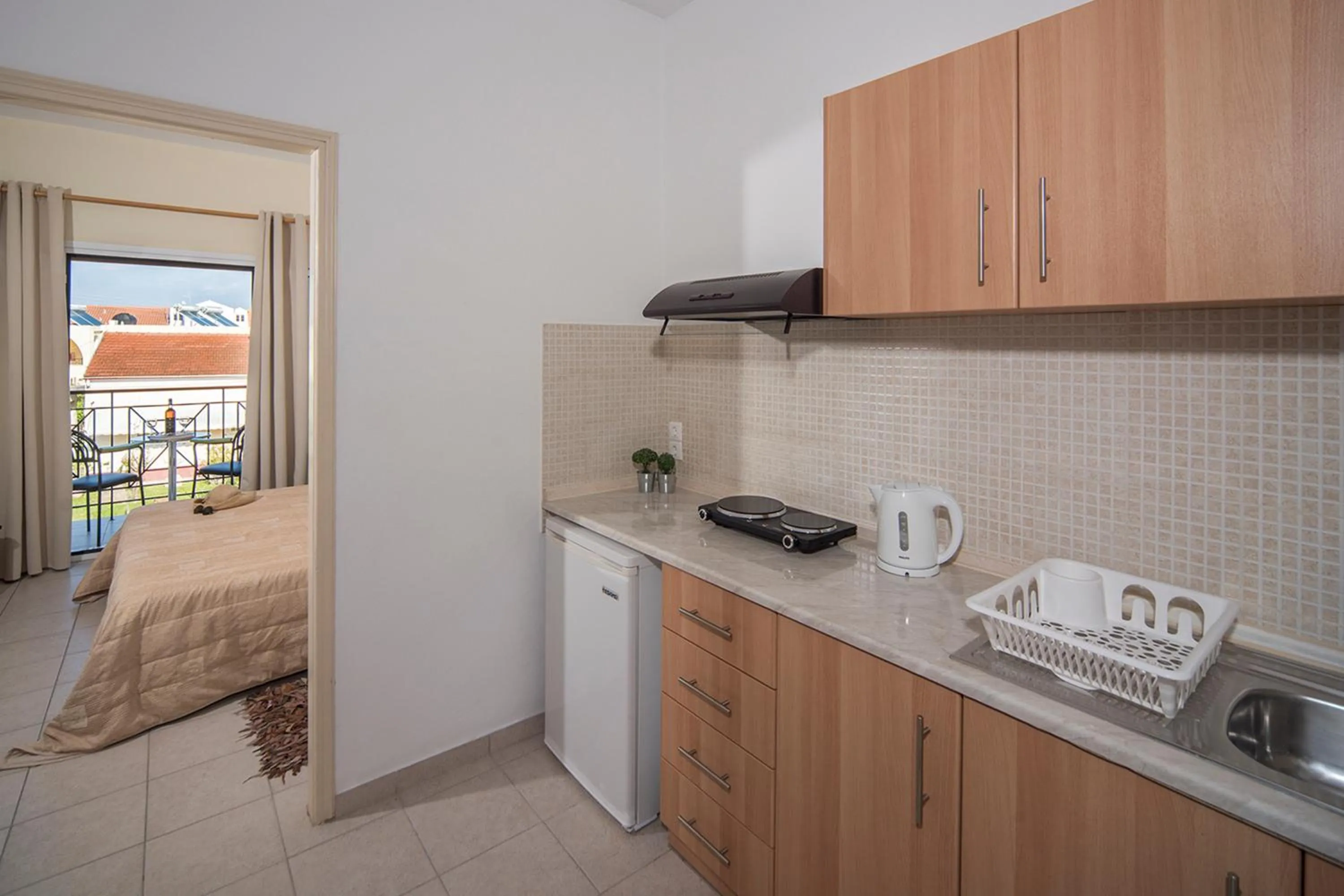 Kitchen or kitchenette, Bed in Metaxa Apartments
