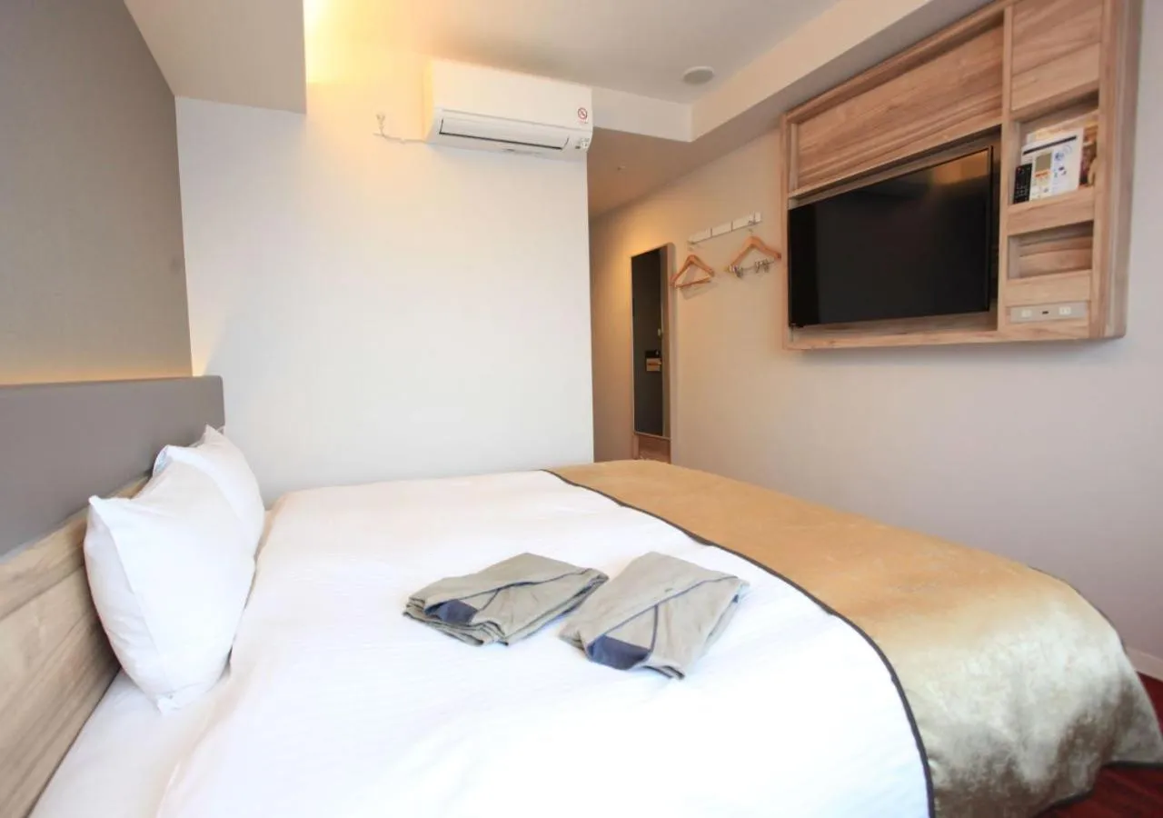 Bed in Urban Hotel Kyoto Gojo Premium