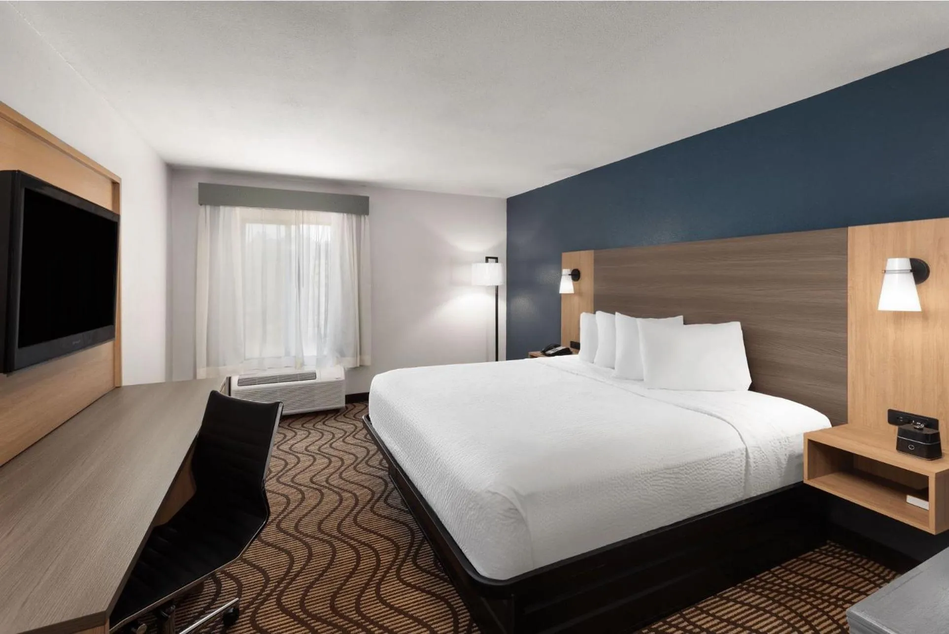 Photo of the whole room, Bed in Baymont by Wyndham Moss Point Pascagoula