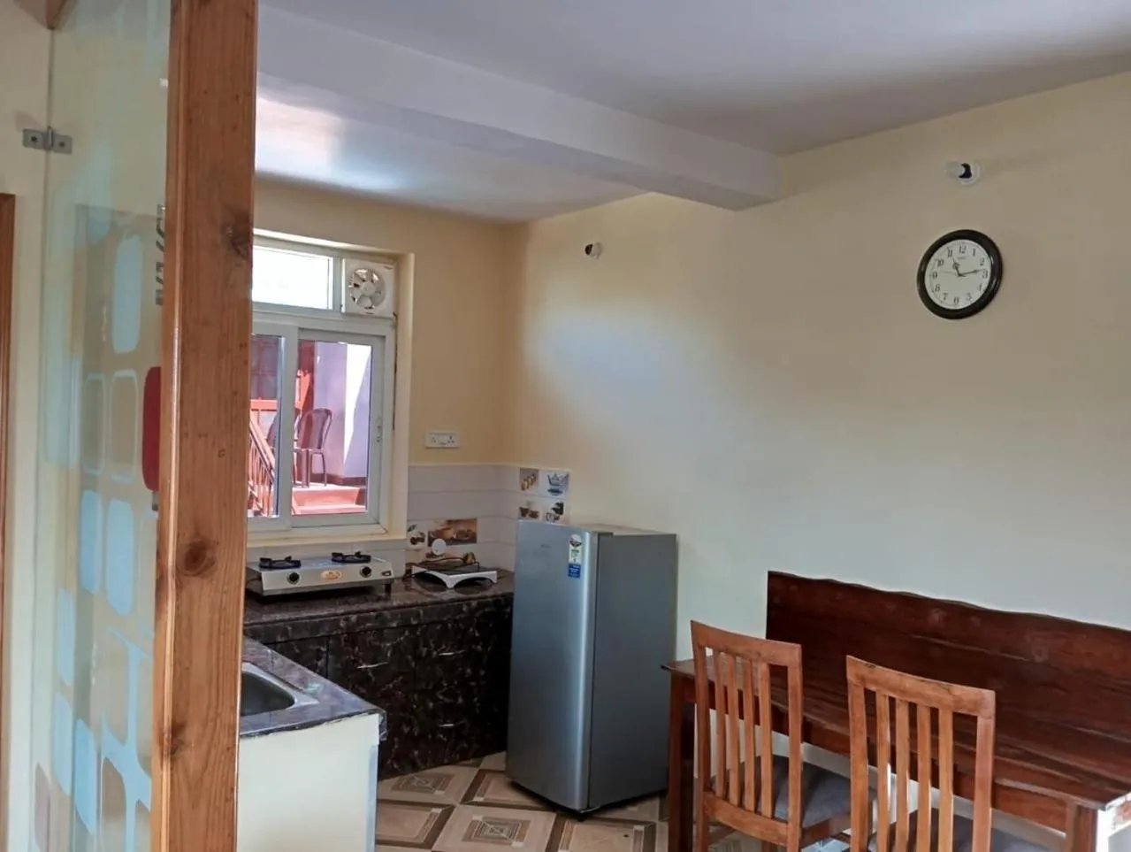 Kitchen or kitchenette in Khushi Cottage