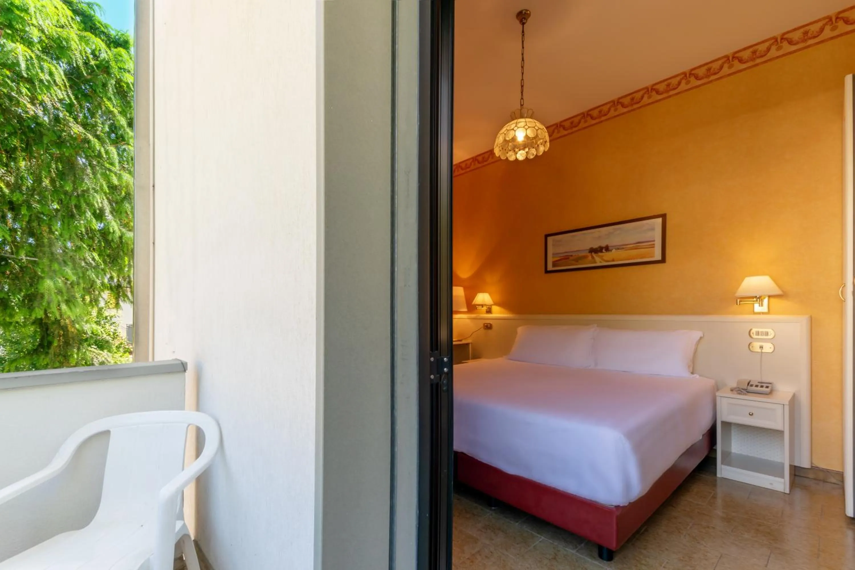 Balcony/Terrace, Bed in Hotel Falco D'Oro by Falco D'Oro Hotels