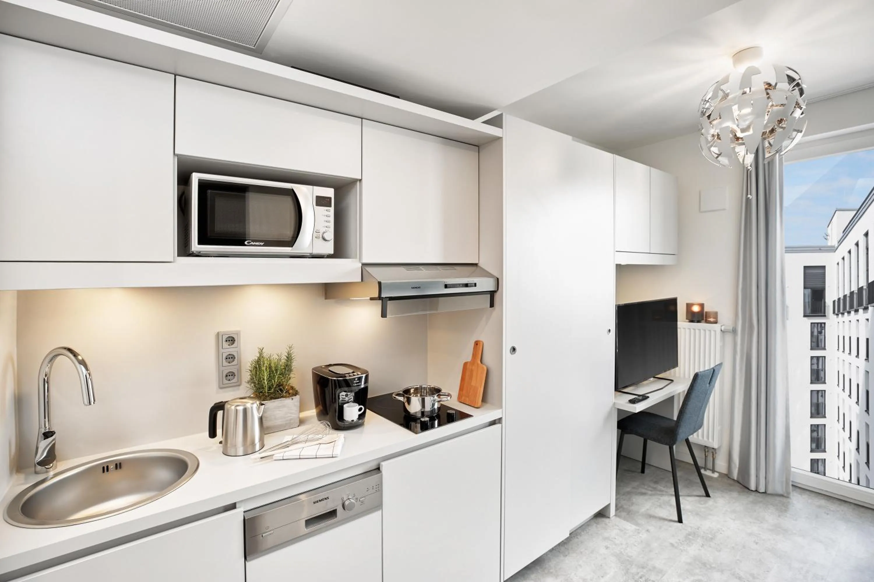 Kitchen or kitchenette in H.ome Serviced Apartments München