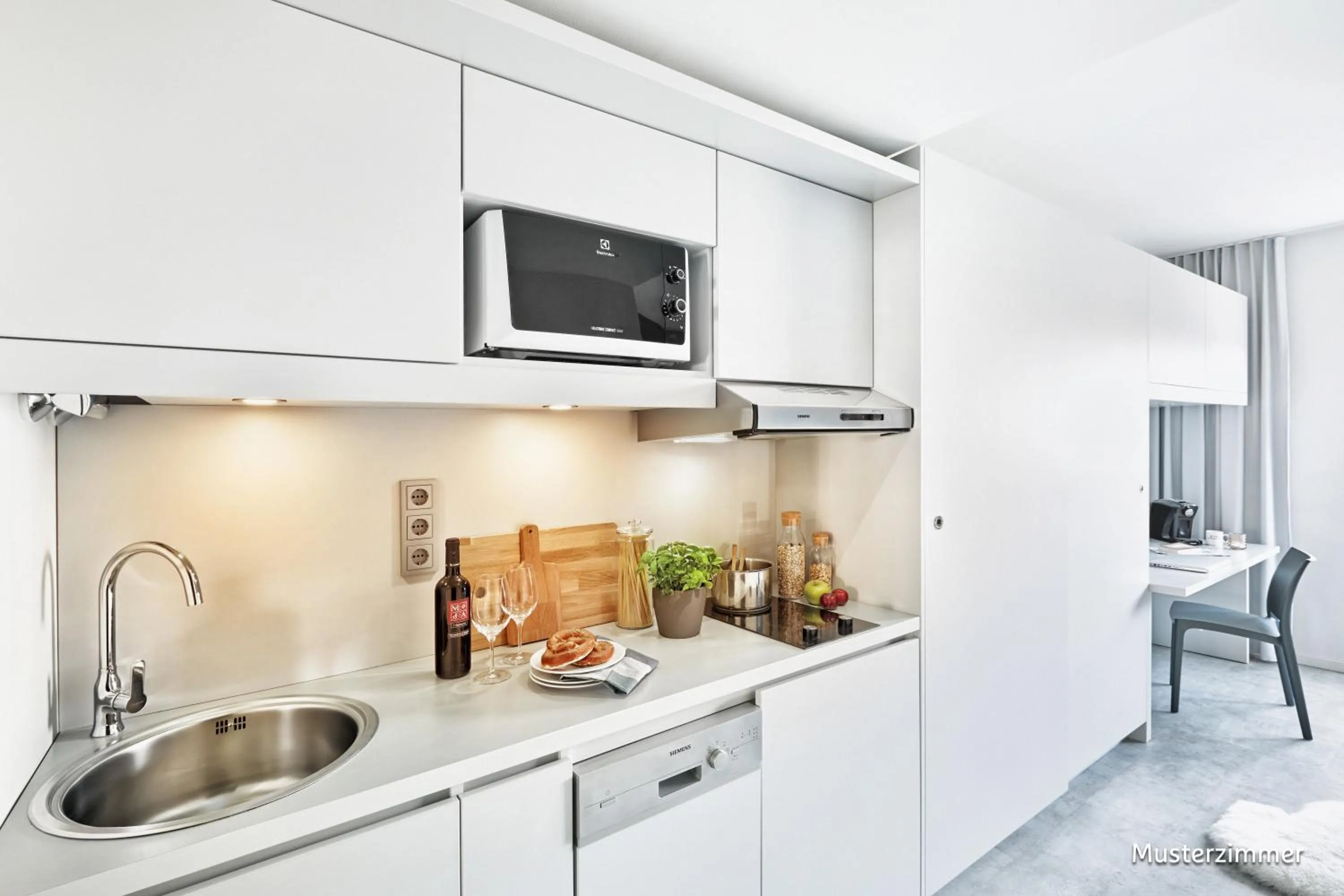 Kitchen or kitchenette in H.ome Serviced Apartments München