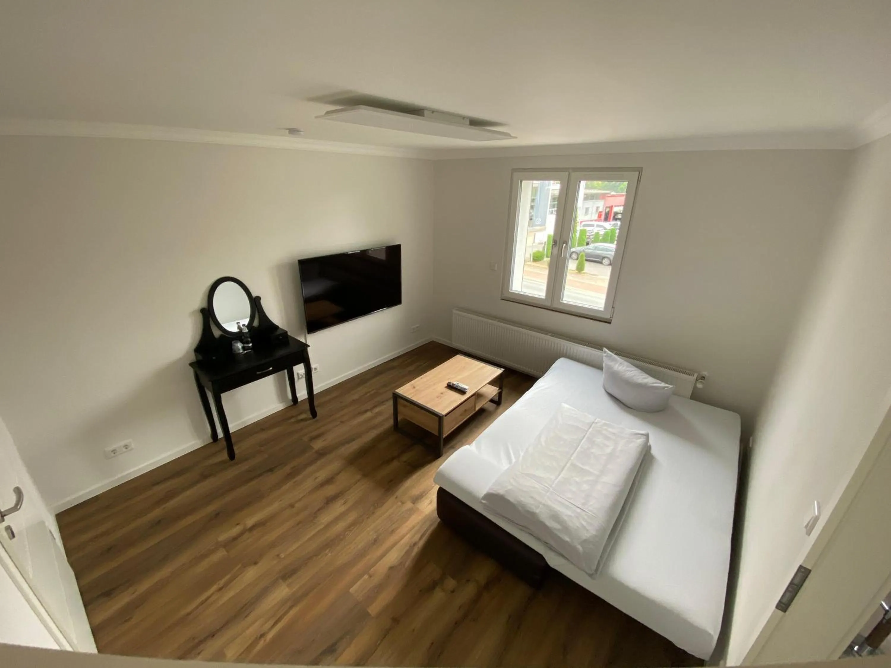 Living room, Bed in RobrookS Hotel Garni