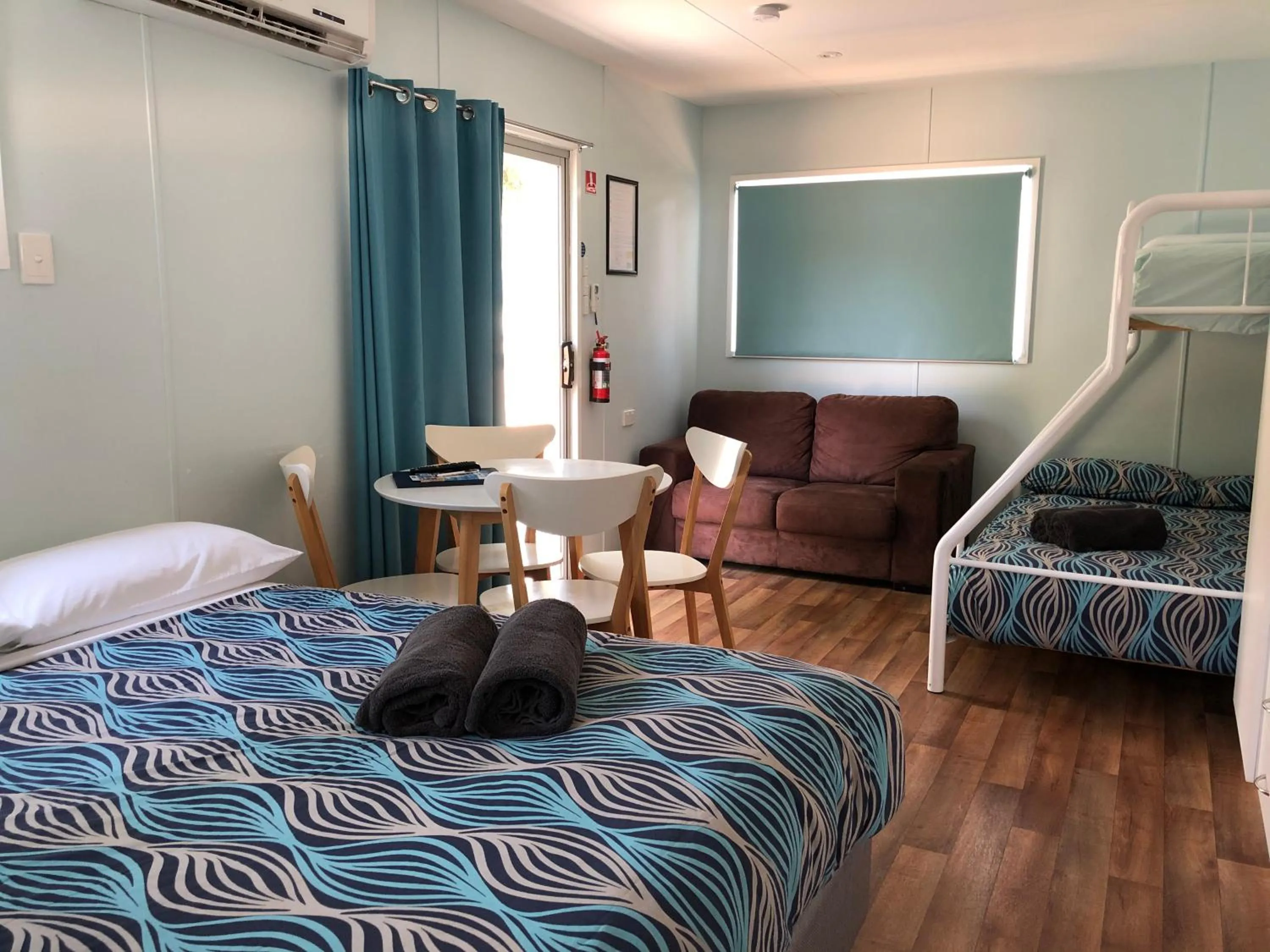 Living room, Bed in Acacia Caravan Park & Holiday Units