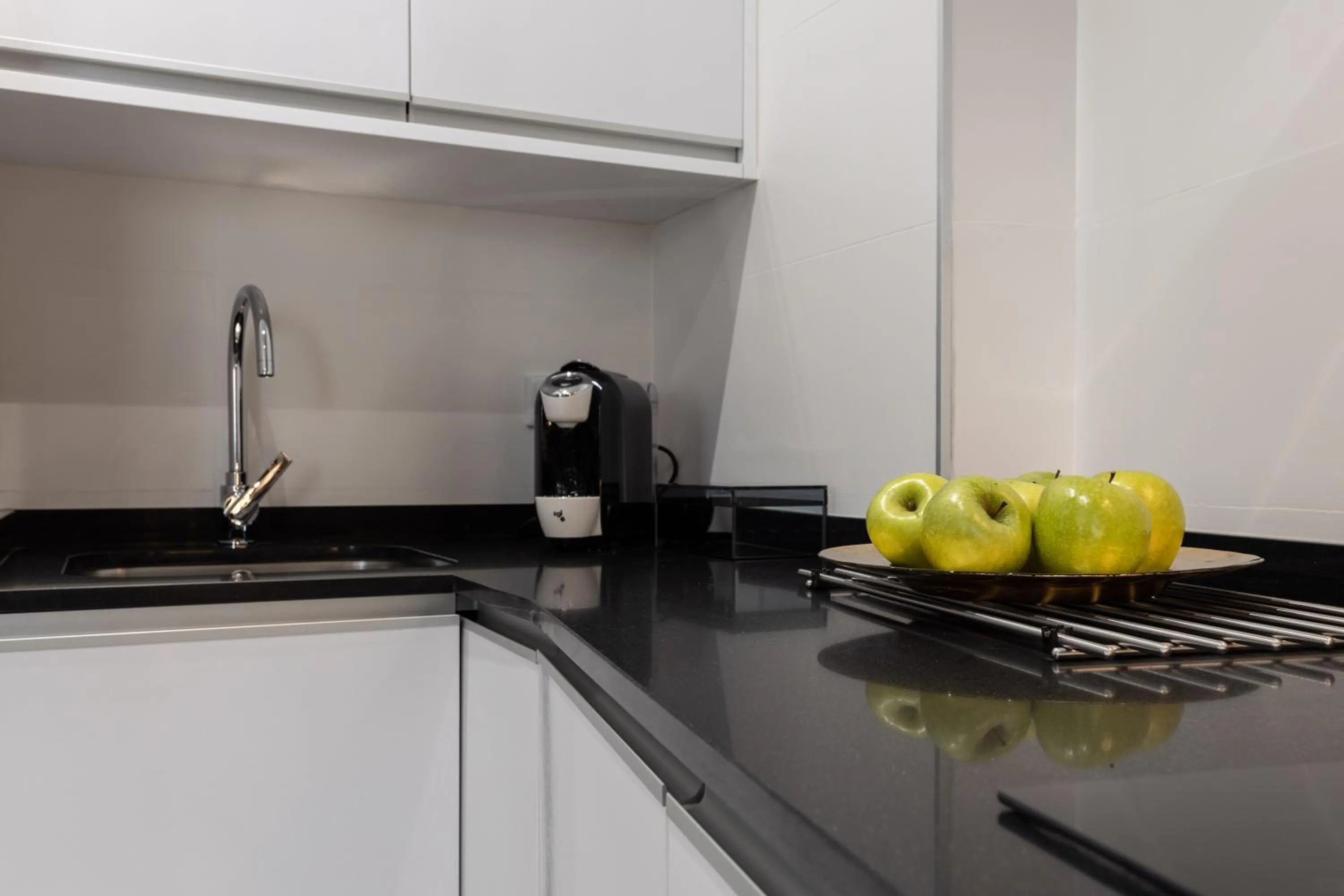 Kitchen or kitchenette in BiBo Suites Plaza Nueva