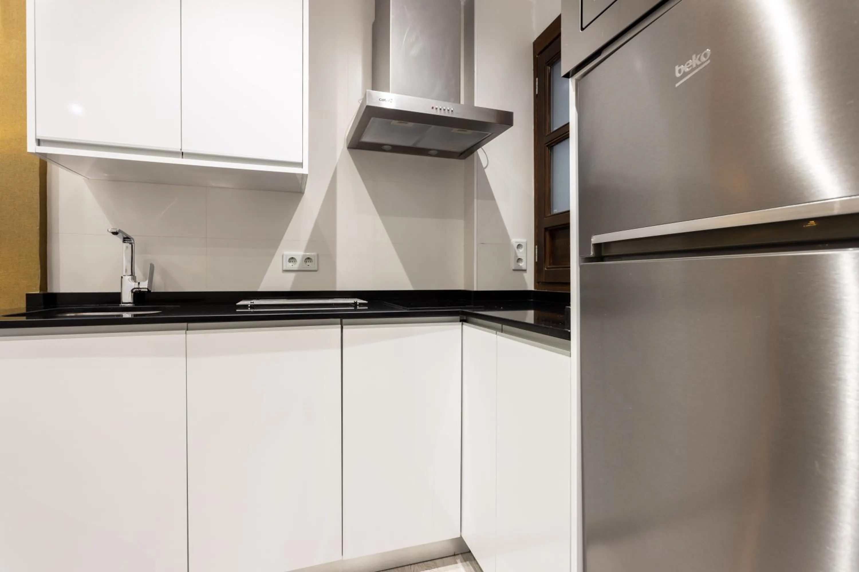 Kitchen or kitchenette in BiBo Suites Plaza Nueva