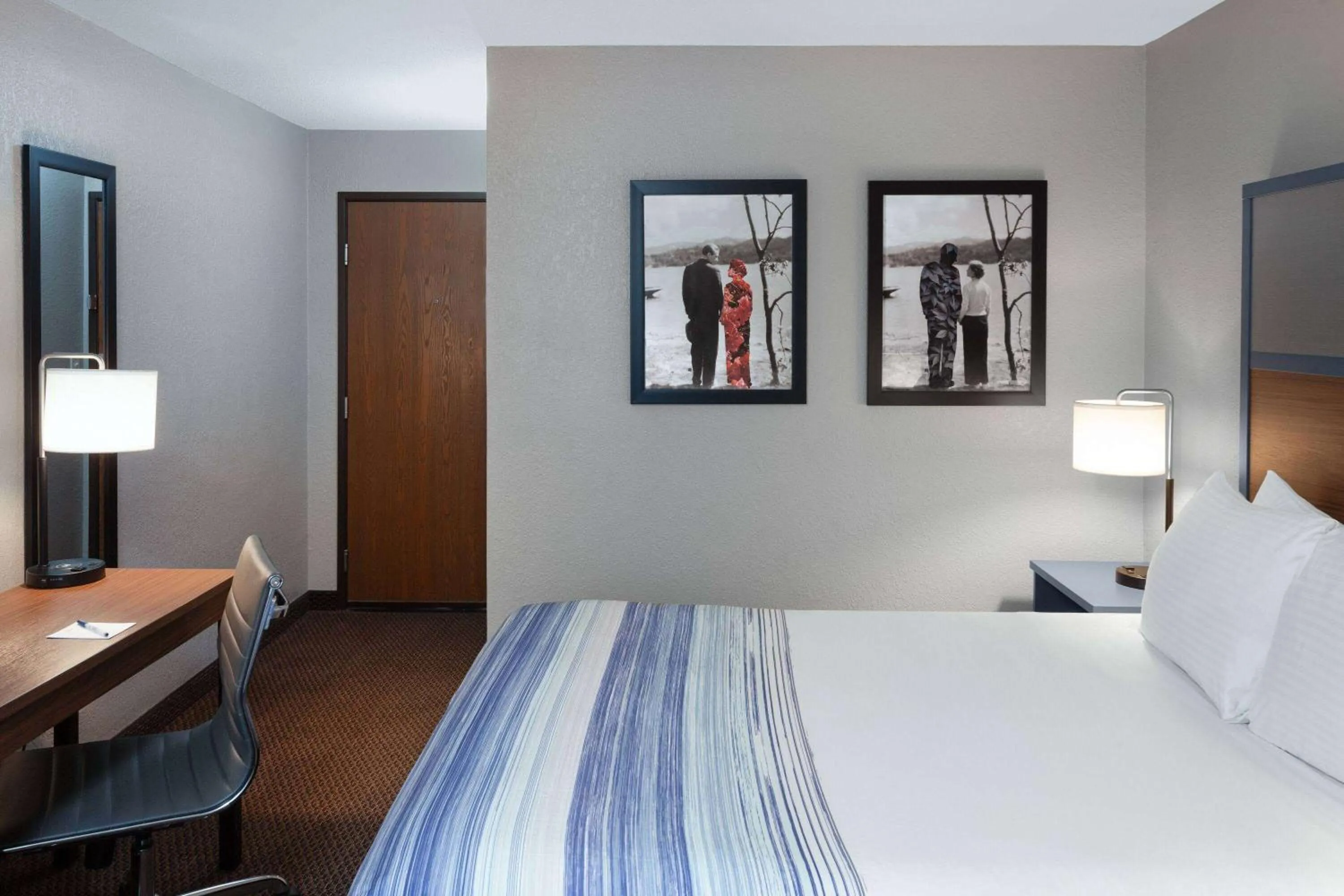 Bed in AmericInn by Wyndham New Richmond