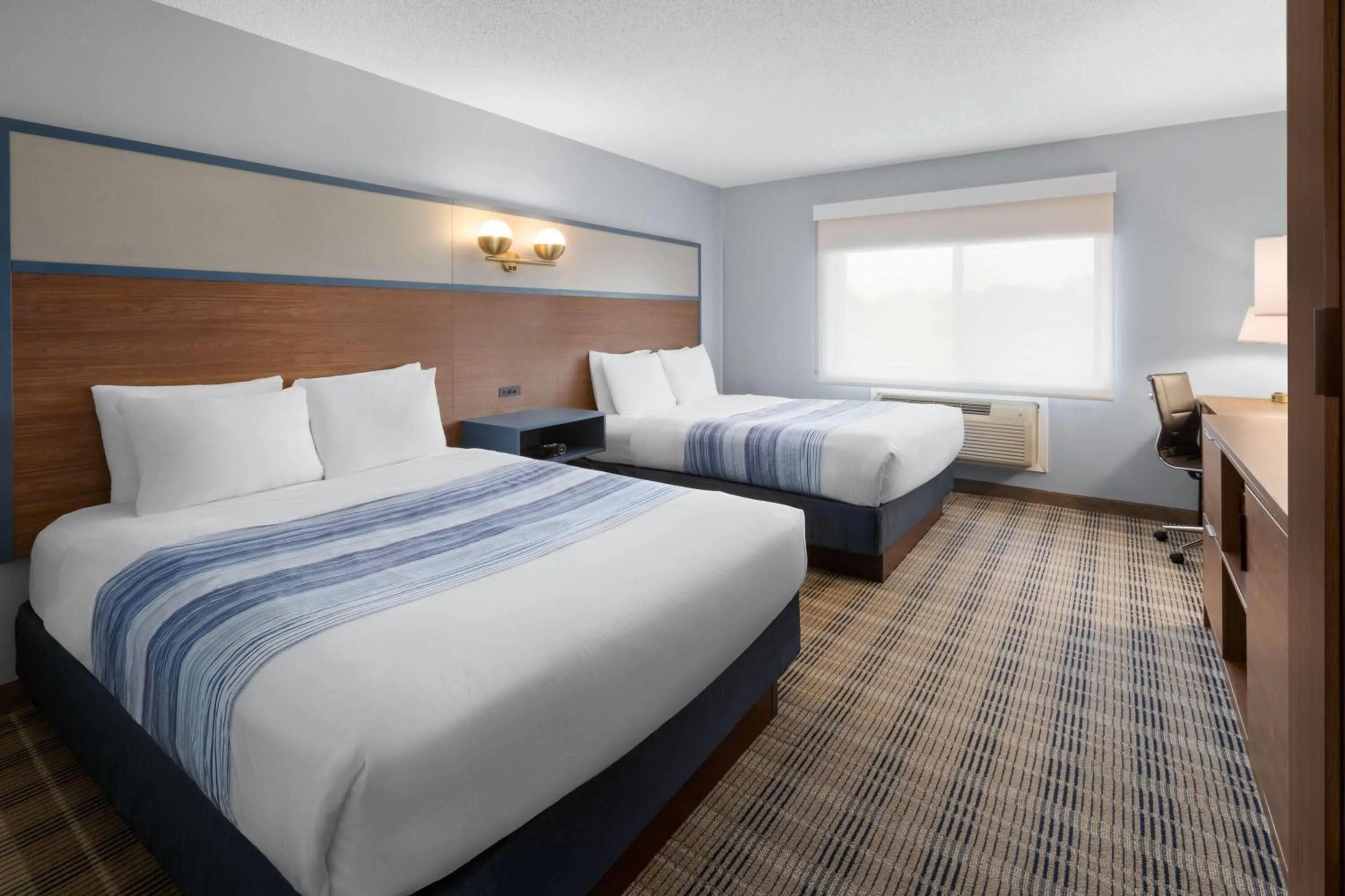 Photo of the whole room, Bed in AmericInn by Wyndham Chippewa Falls