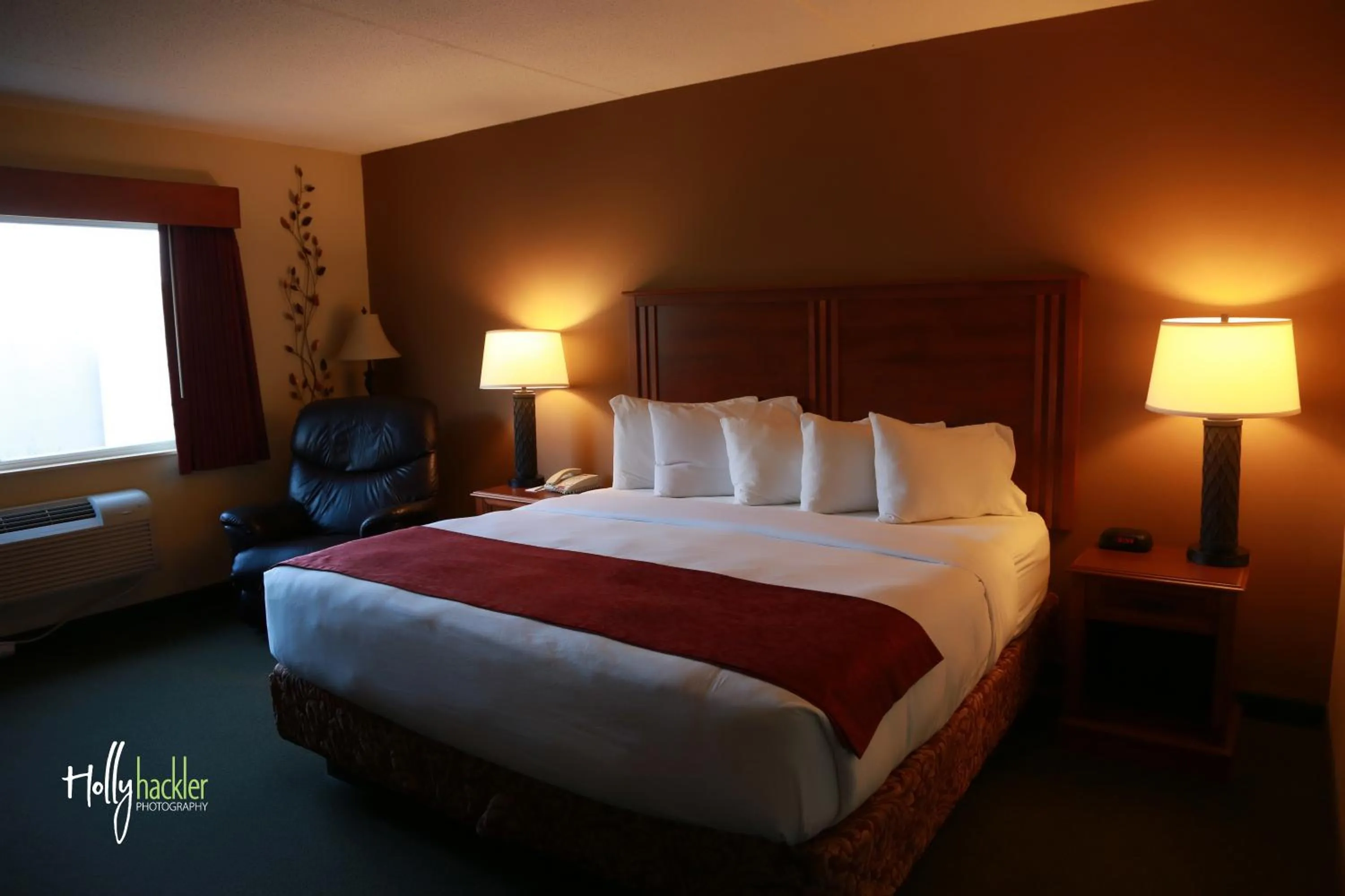 Bed in AmericInn by Wyndham McAlester