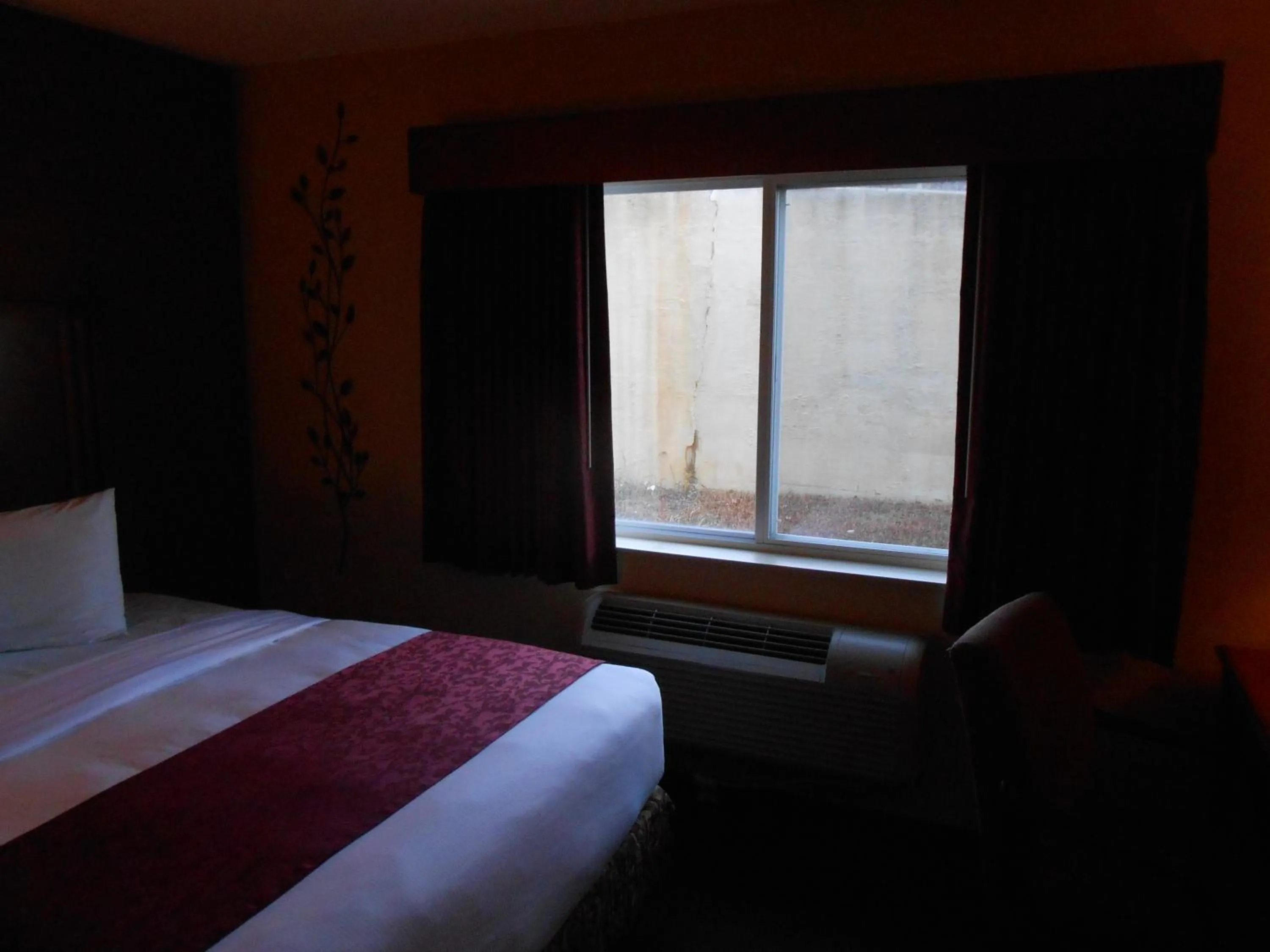 Bed in AmericInn by Wyndham McAlester