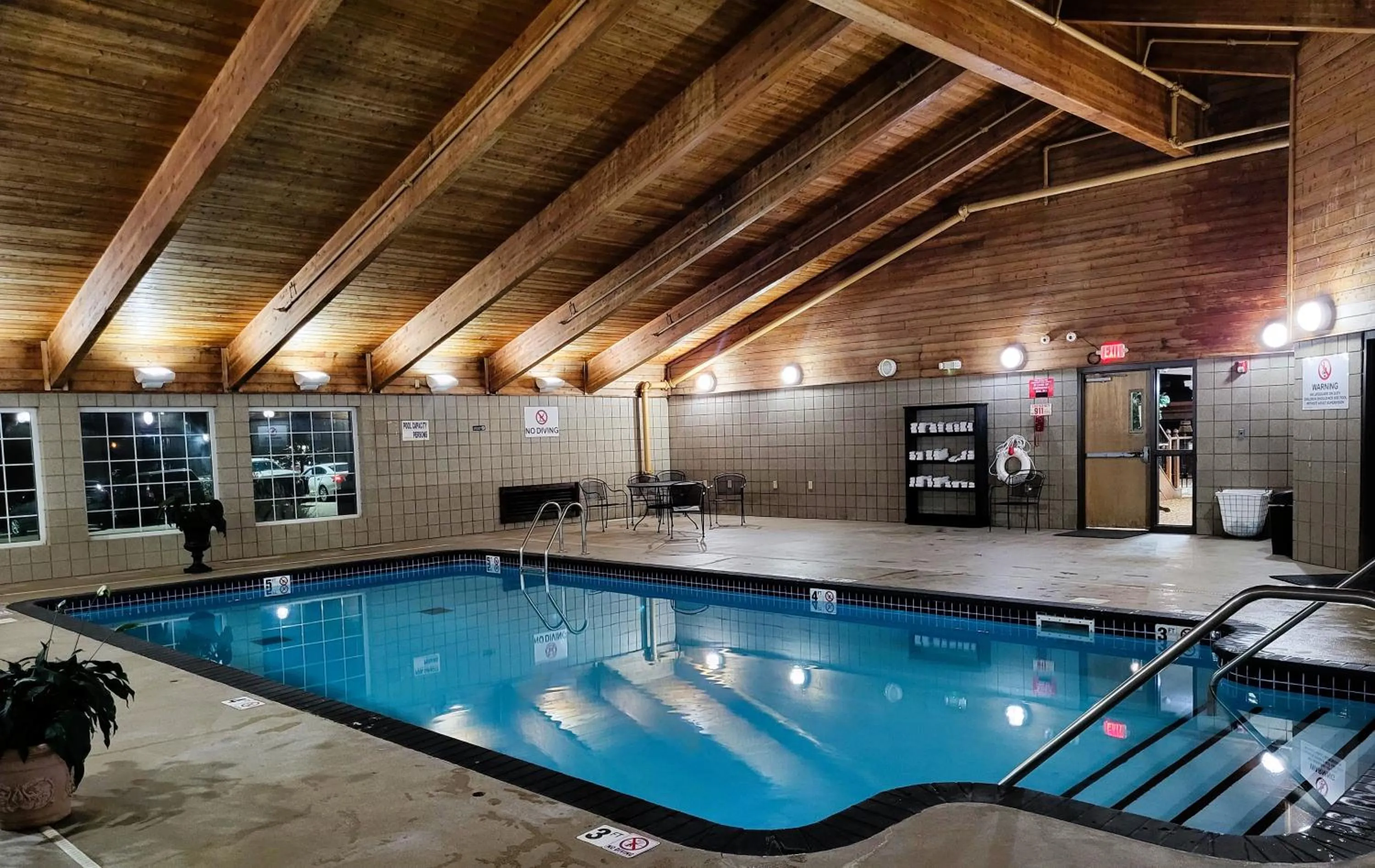 Swimming pool in AmericInn by Wyndham McAlester