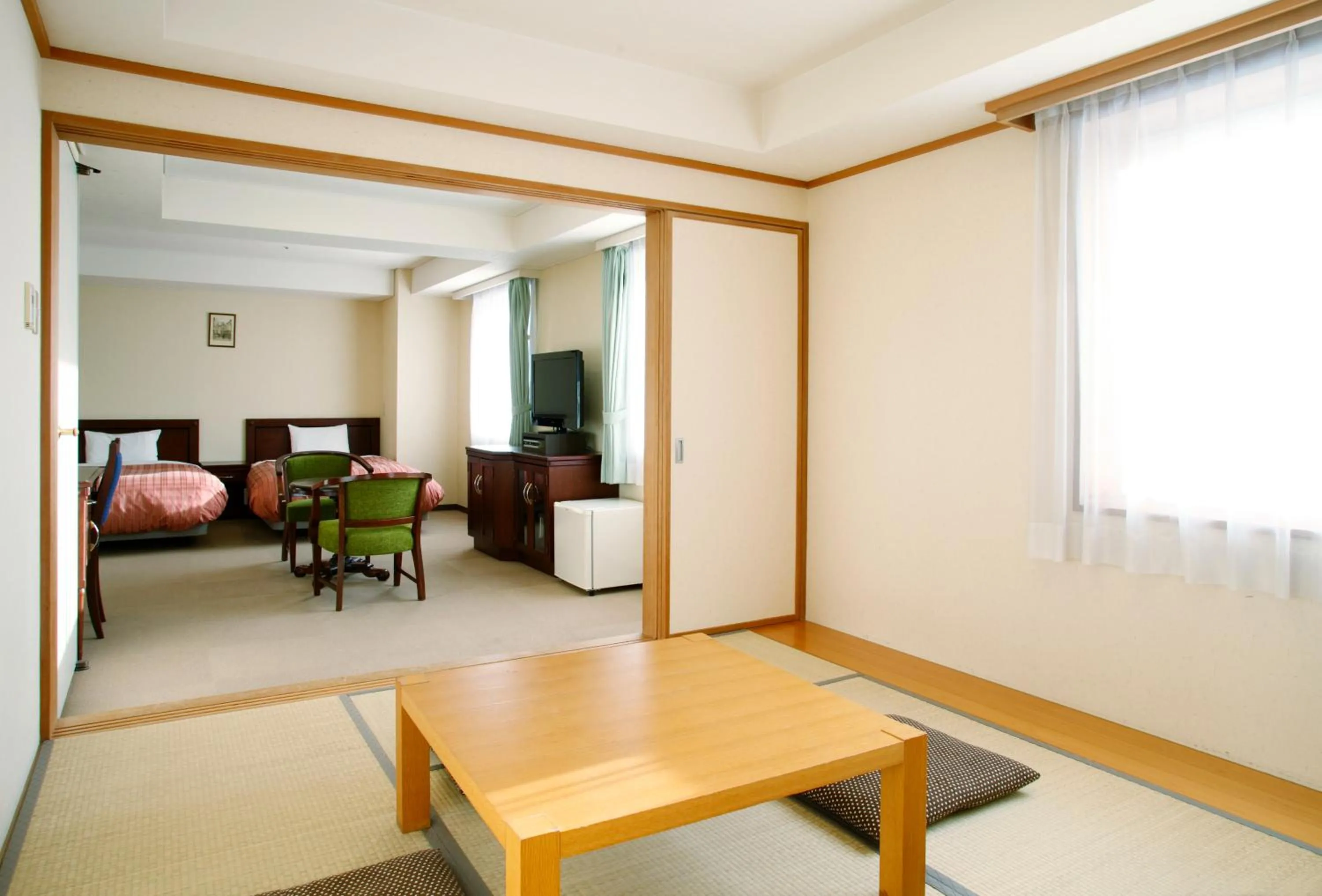 Living room, Bed in Chitose Station Hotel