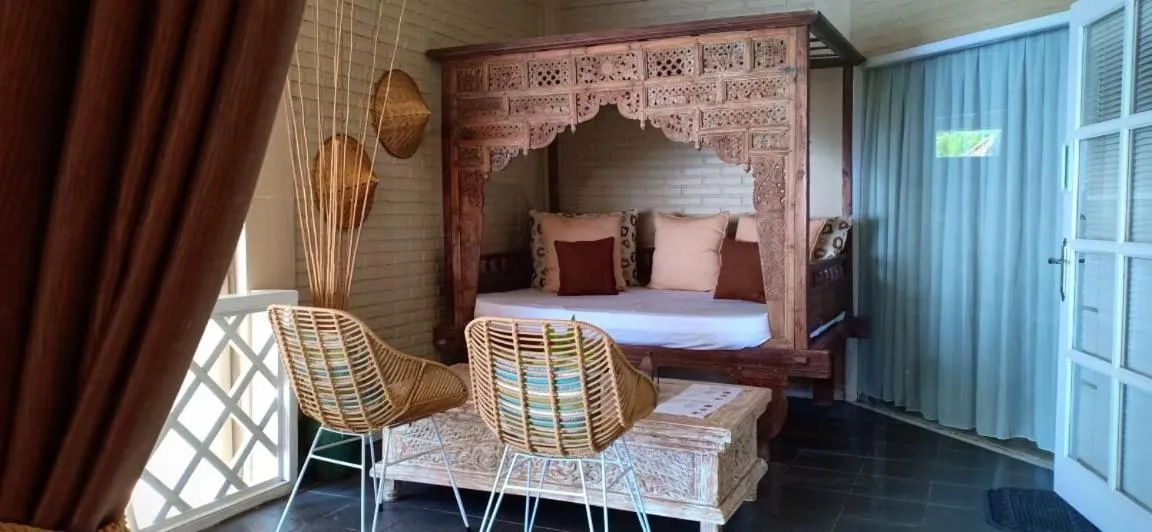 Seating area, Bed in Tauch Terminal Resort Tulamben & Spa