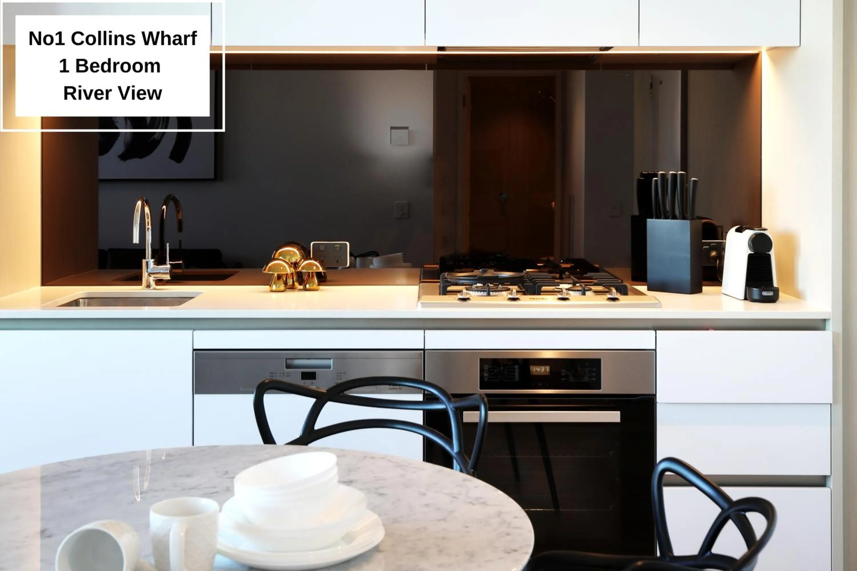 Kitchen or kitchenette in Orange Stay at Collins Wharf
