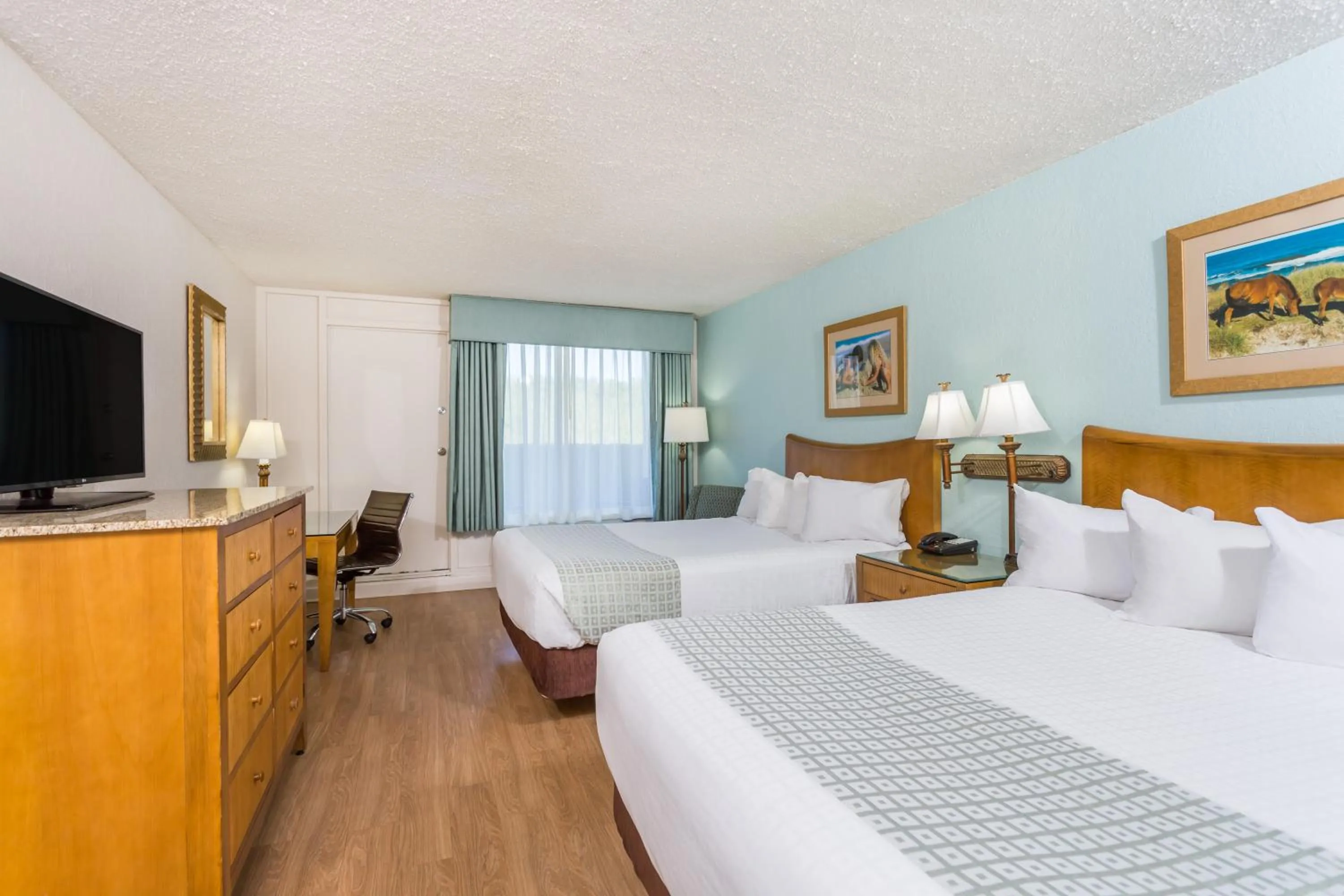 Photo of the whole room, Bed in Ramada Plaza by Wyndham Nags Head Oceanfront