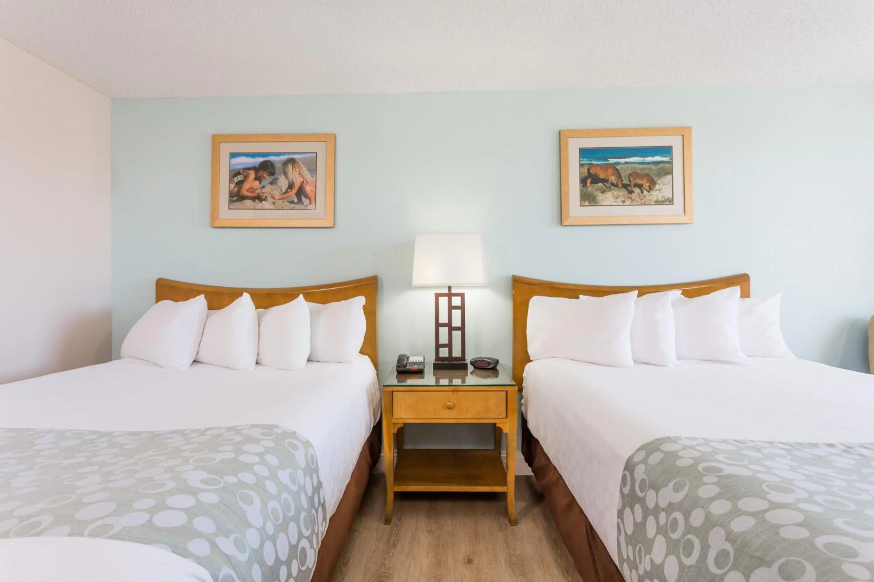 Bed in Ramada Plaza by Wyndham Nags Head Oceanfront