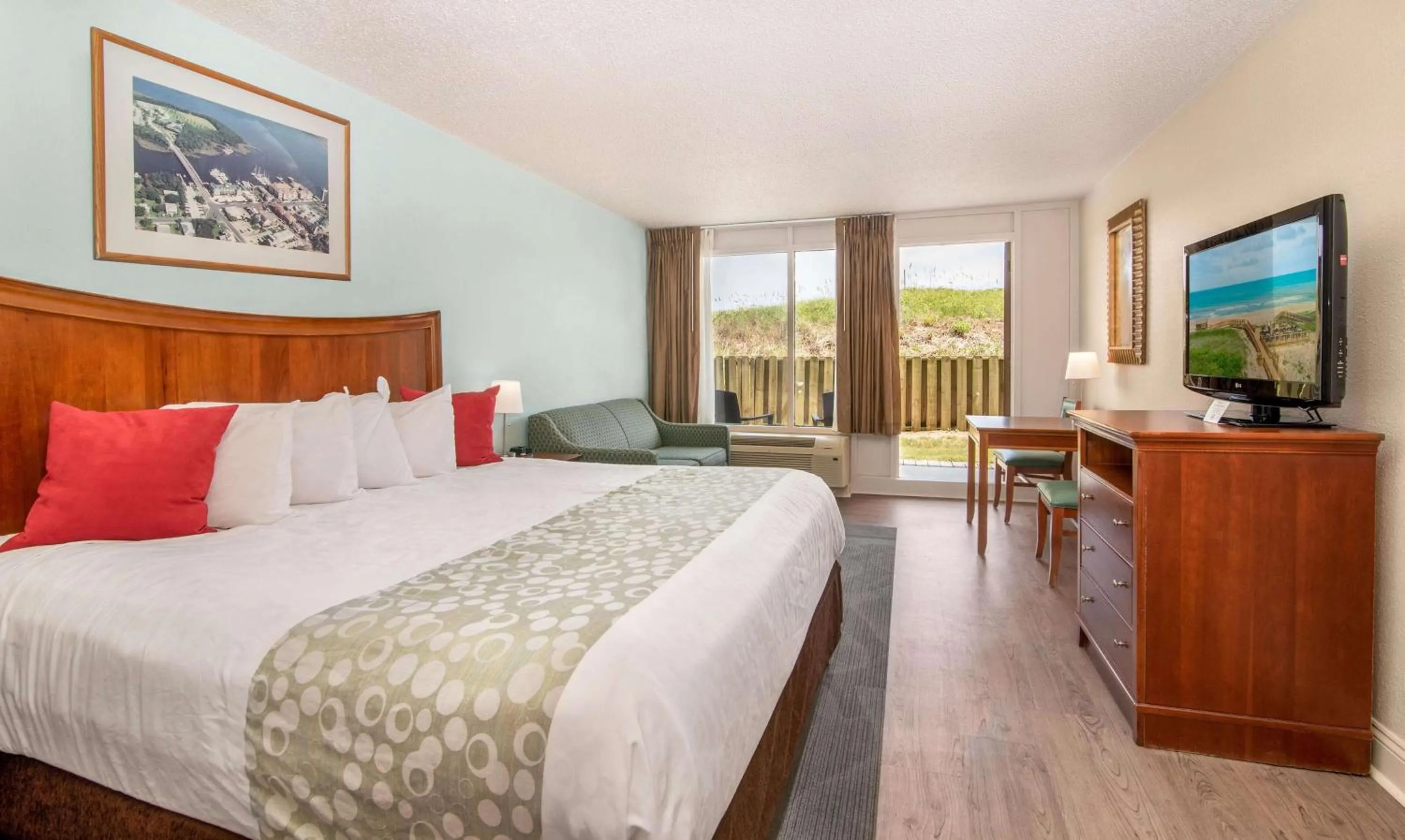 Photo of the whole room, Bed in Ramada Plaza by Wyndham Nags Head Oceanfront