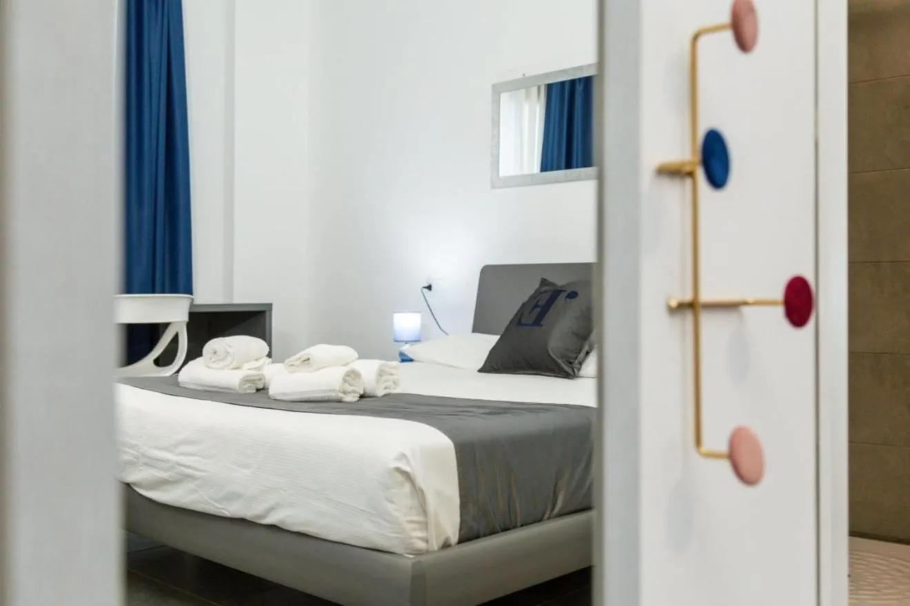 Bed in L'Essenza Hotel