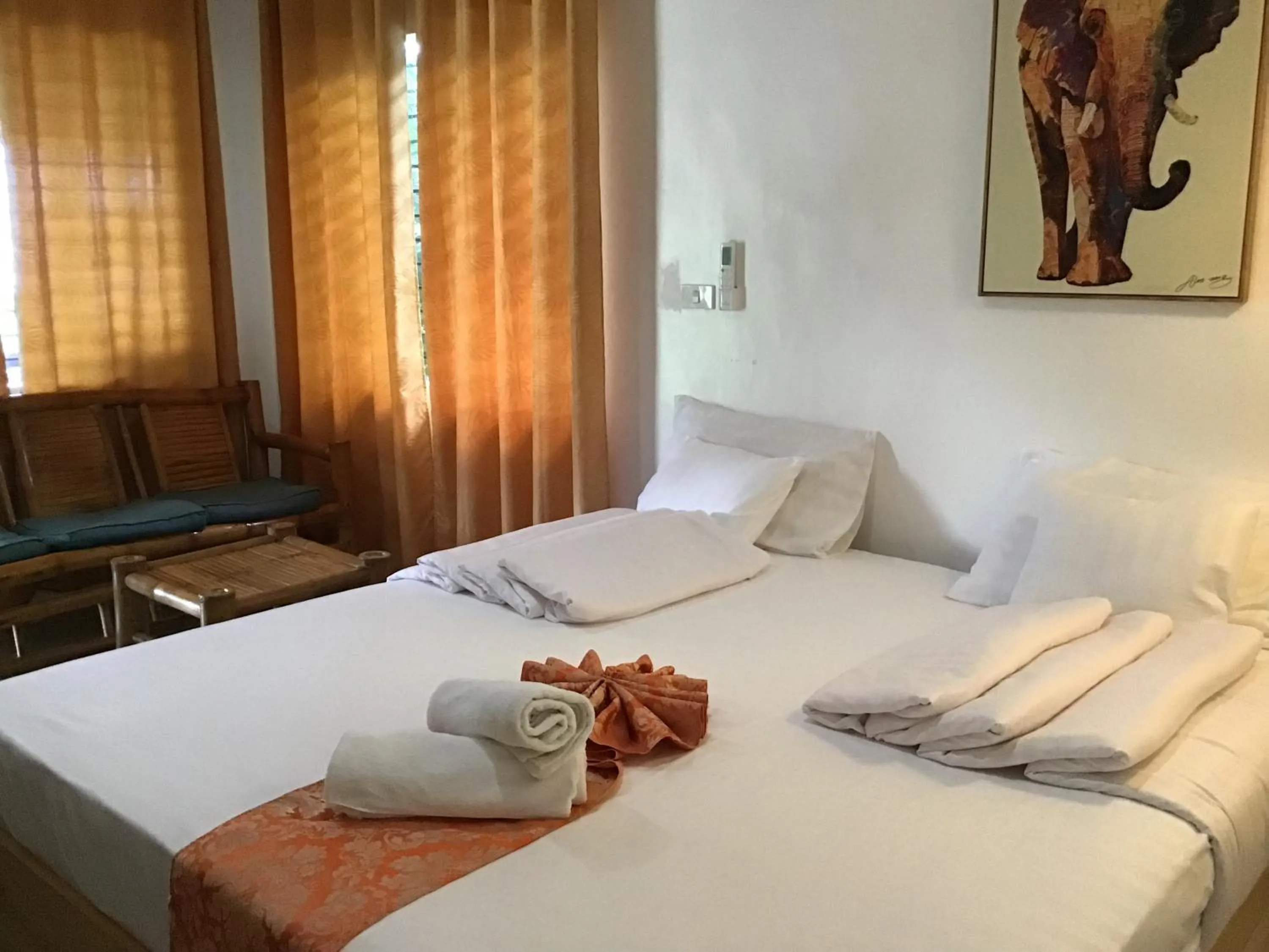 Bed in Cuestas Beach Resort and Restaurant