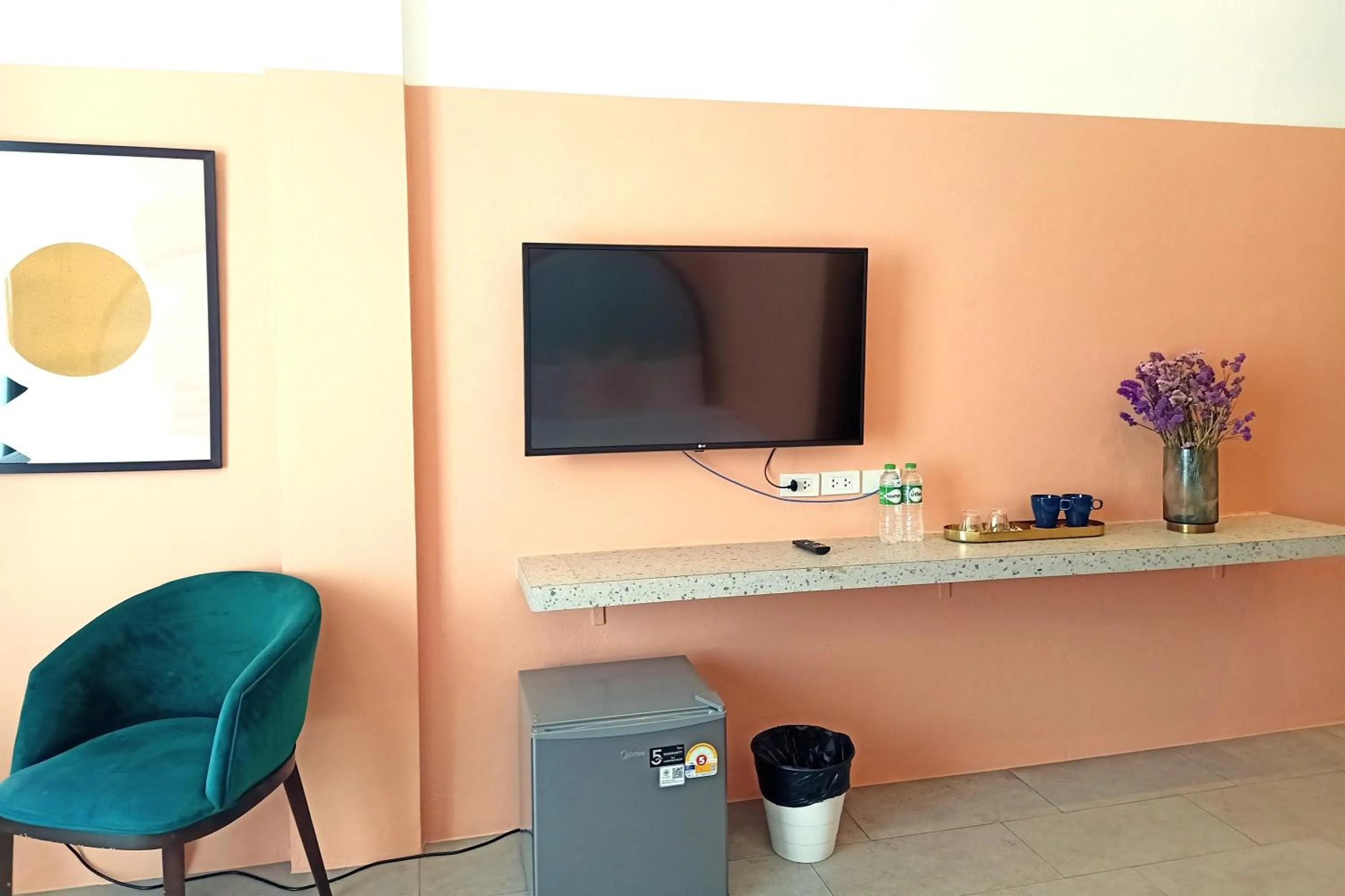 TV and multimedia in Our Nomad Boutique Hostel