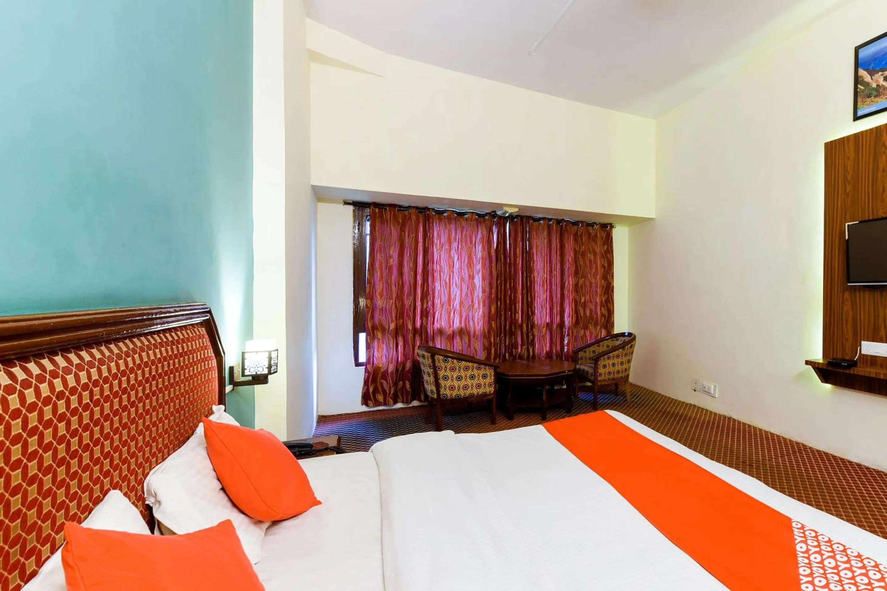 Bed in Hotel Sitara International