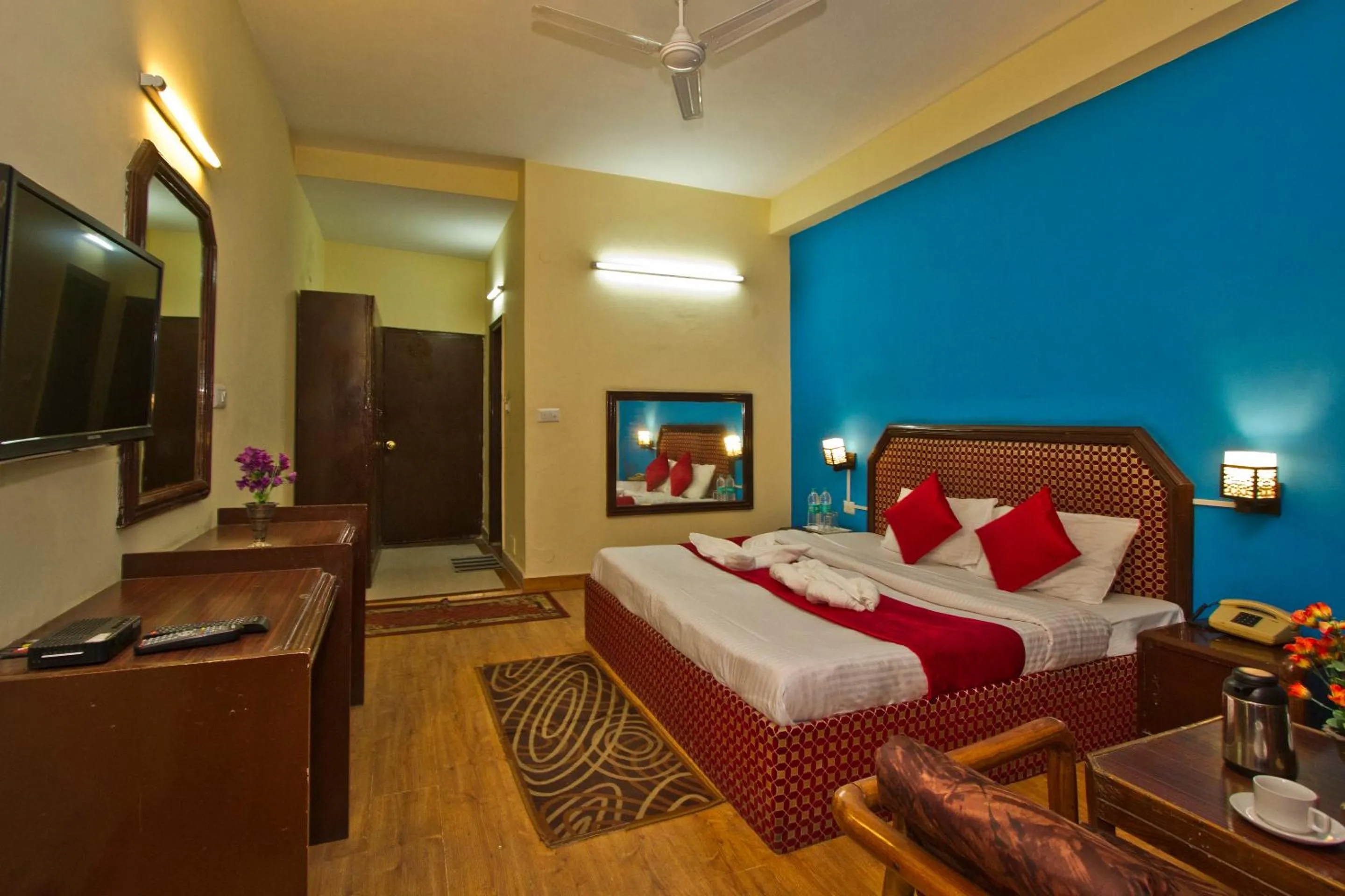 Bed in Hotel Sitara International