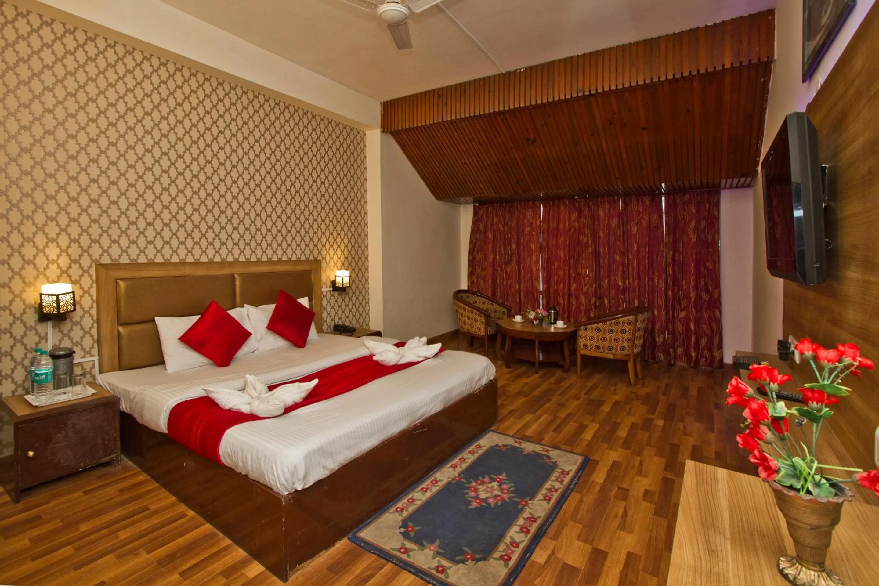 Bed in Hotel Sitara International