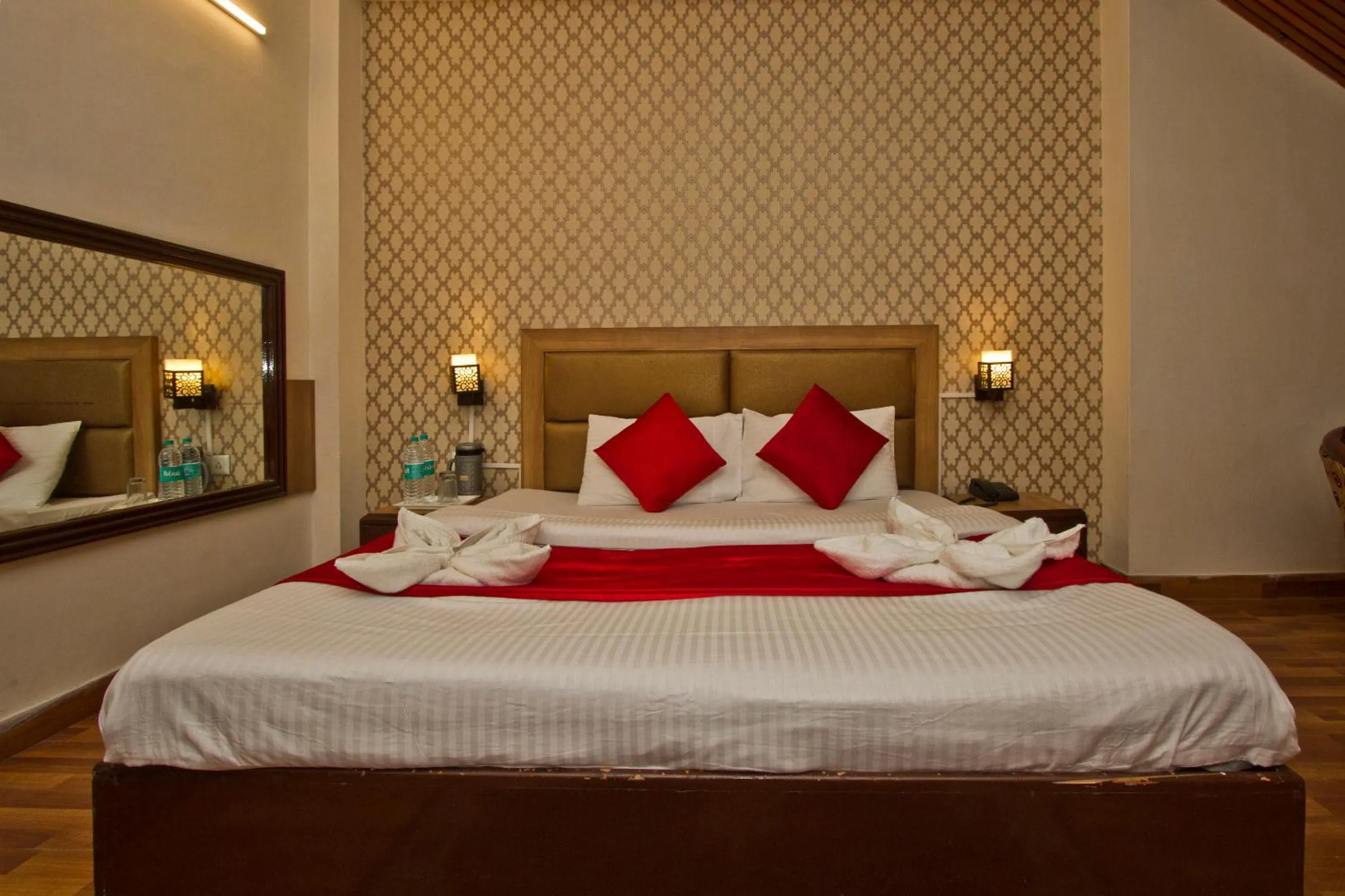 Bed in Hotel Sitara International