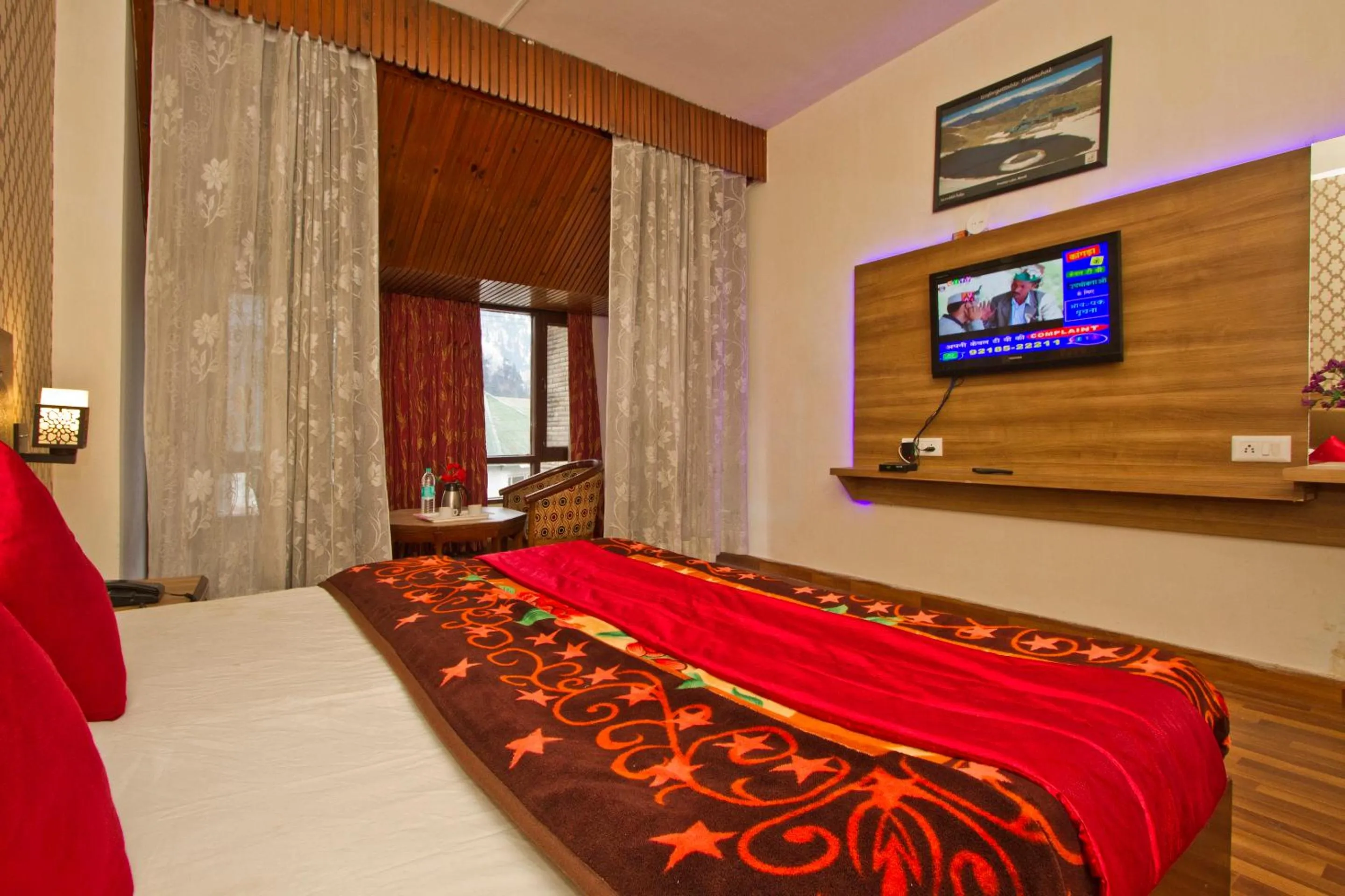 Bed in Hotel Sitara International