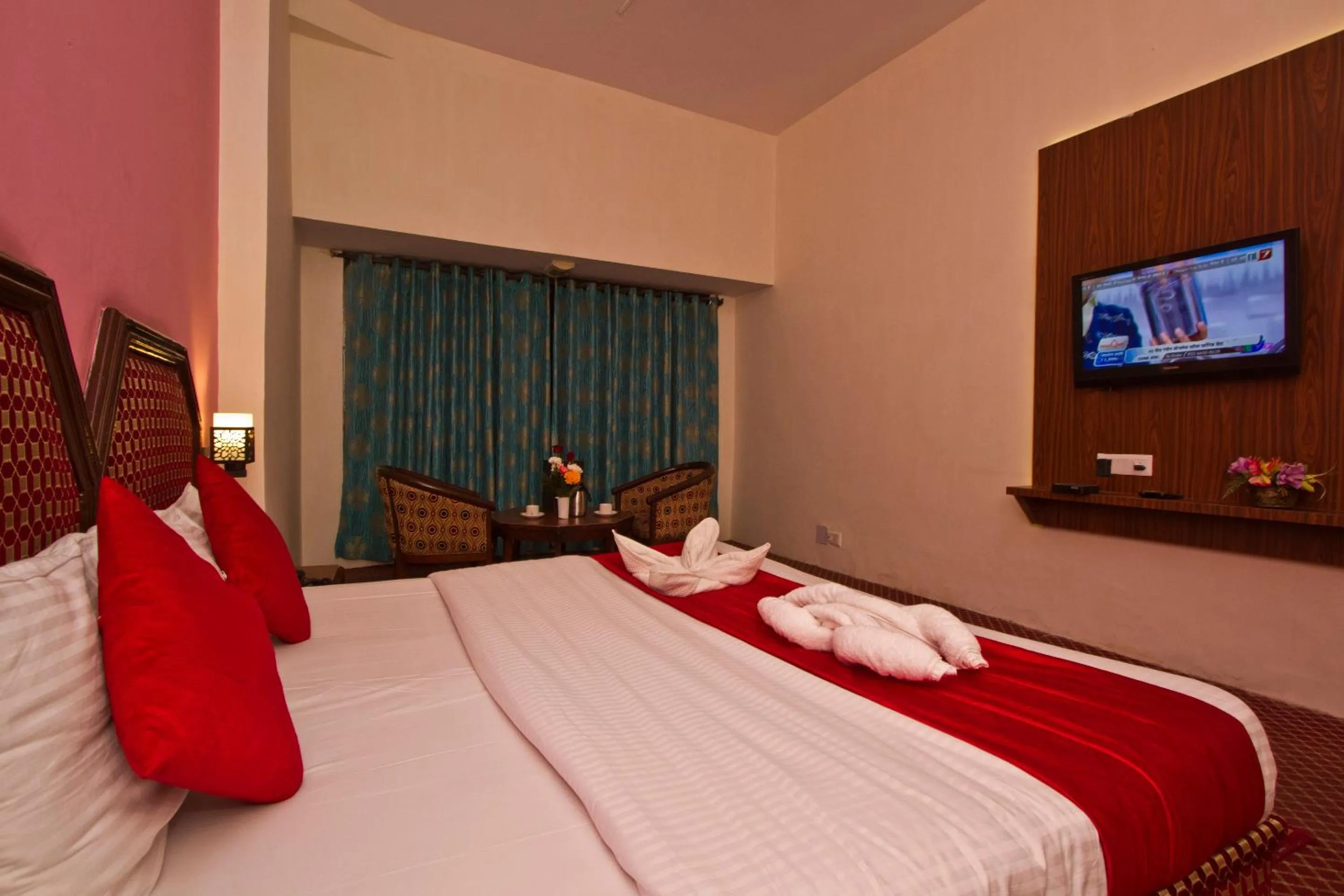 Bed in Hotel Sitara International