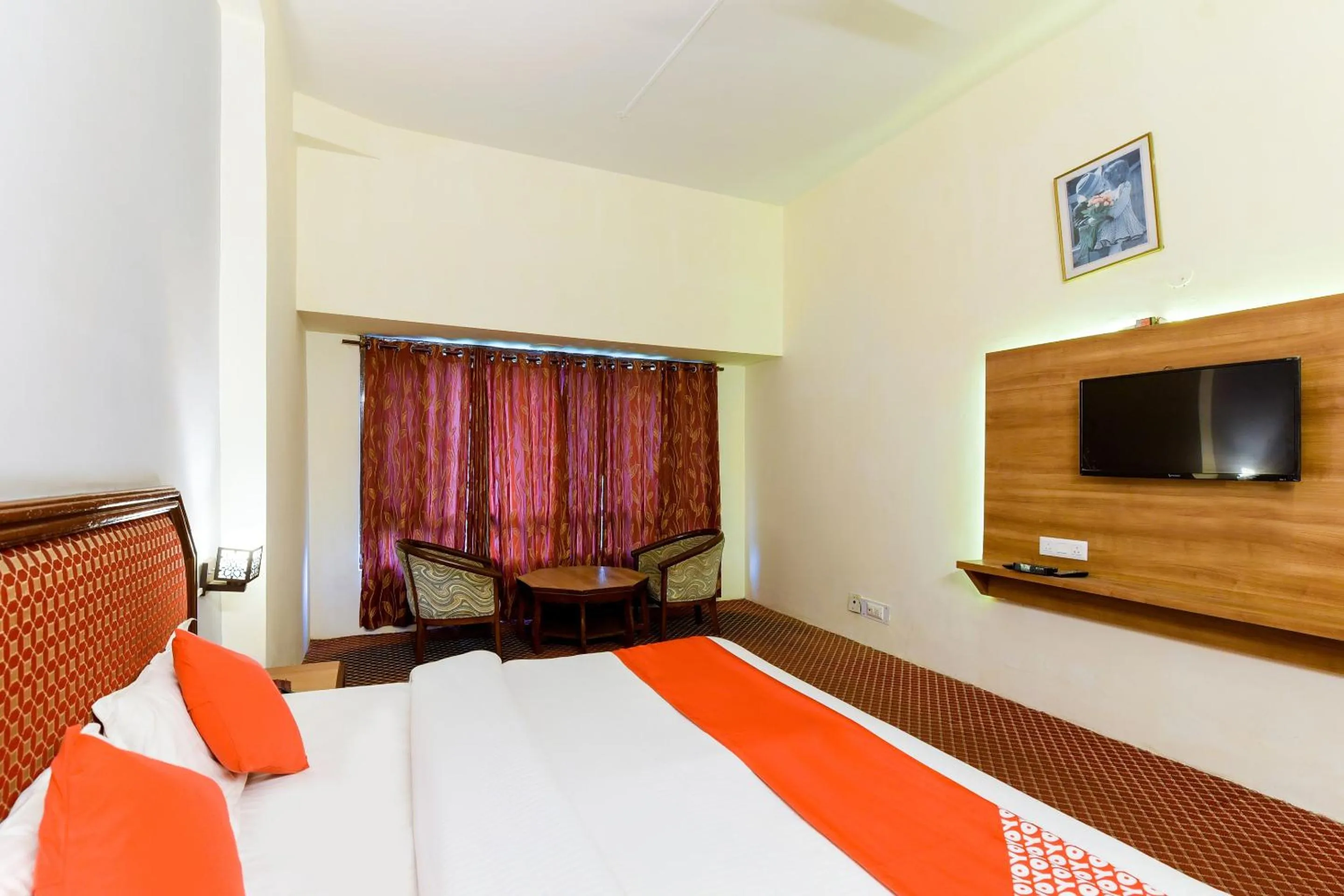 Bed in Hotel Sitara International