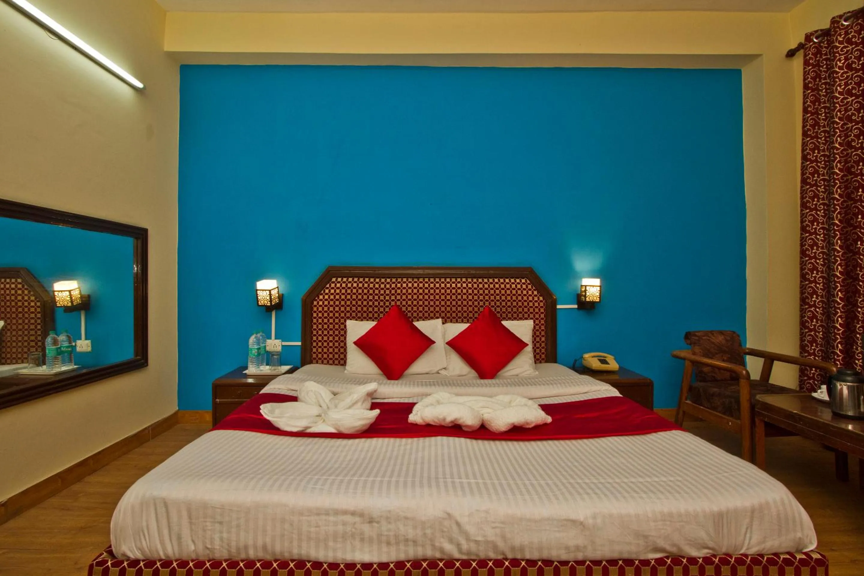 Bed in Hotel Sitara International