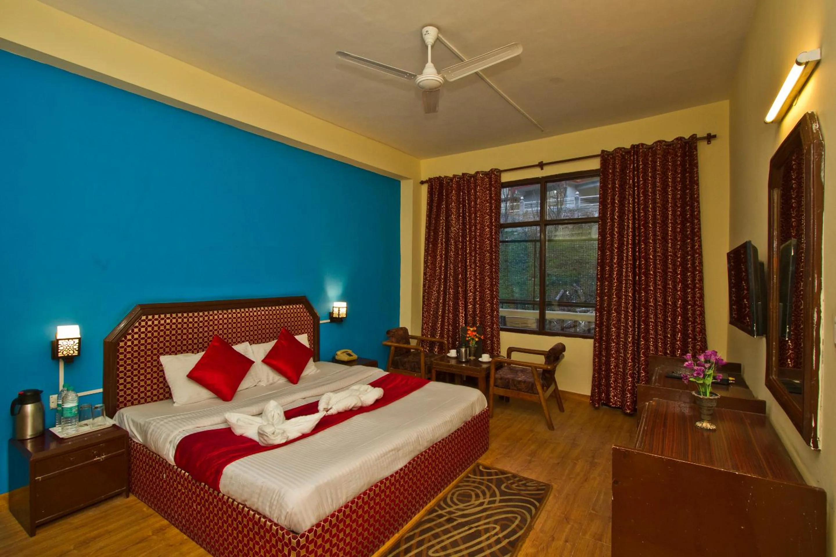 Bed in Hotel Sitara International