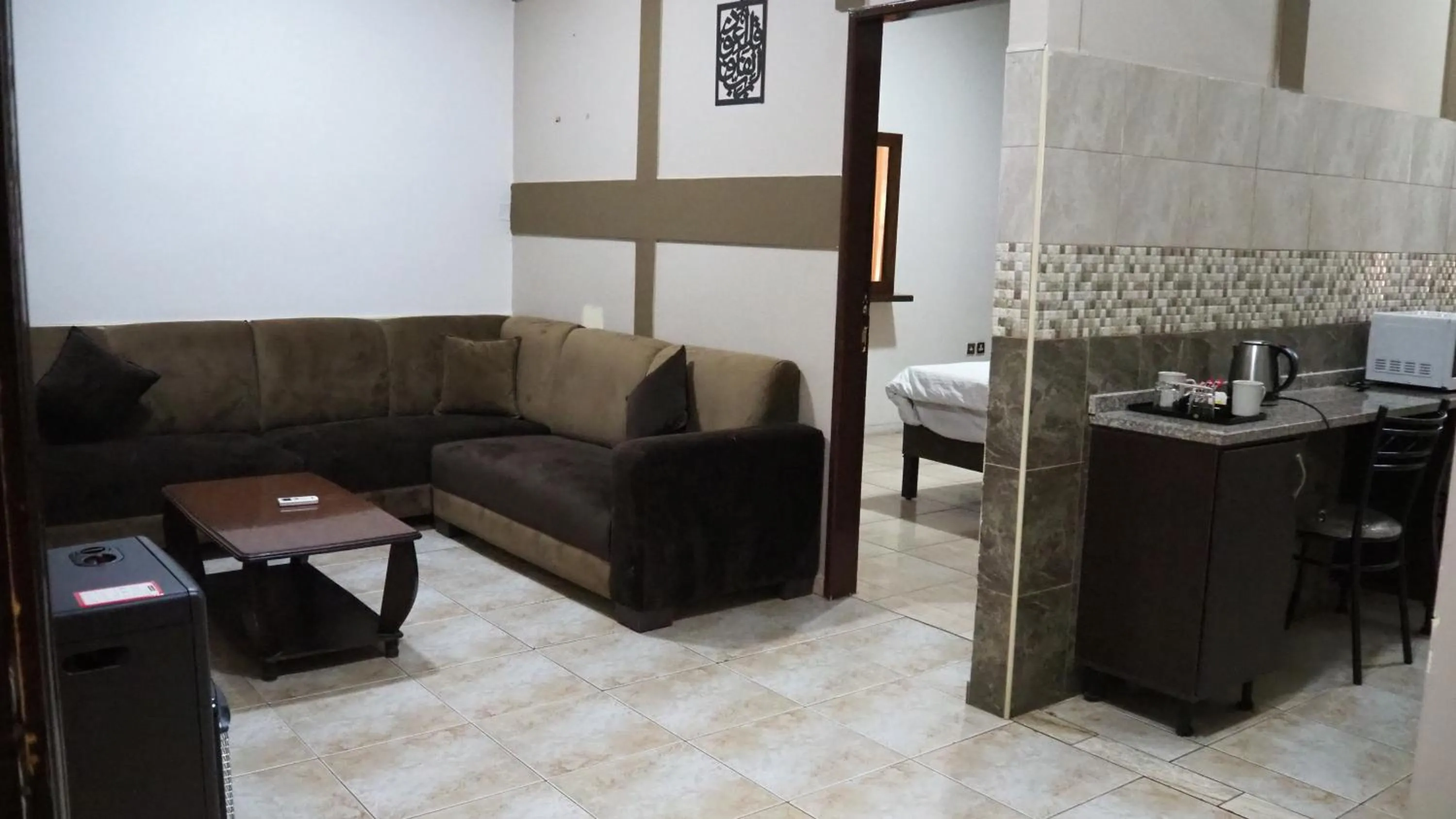 Living room, Bed in Al Fawanes Hotel Apartments