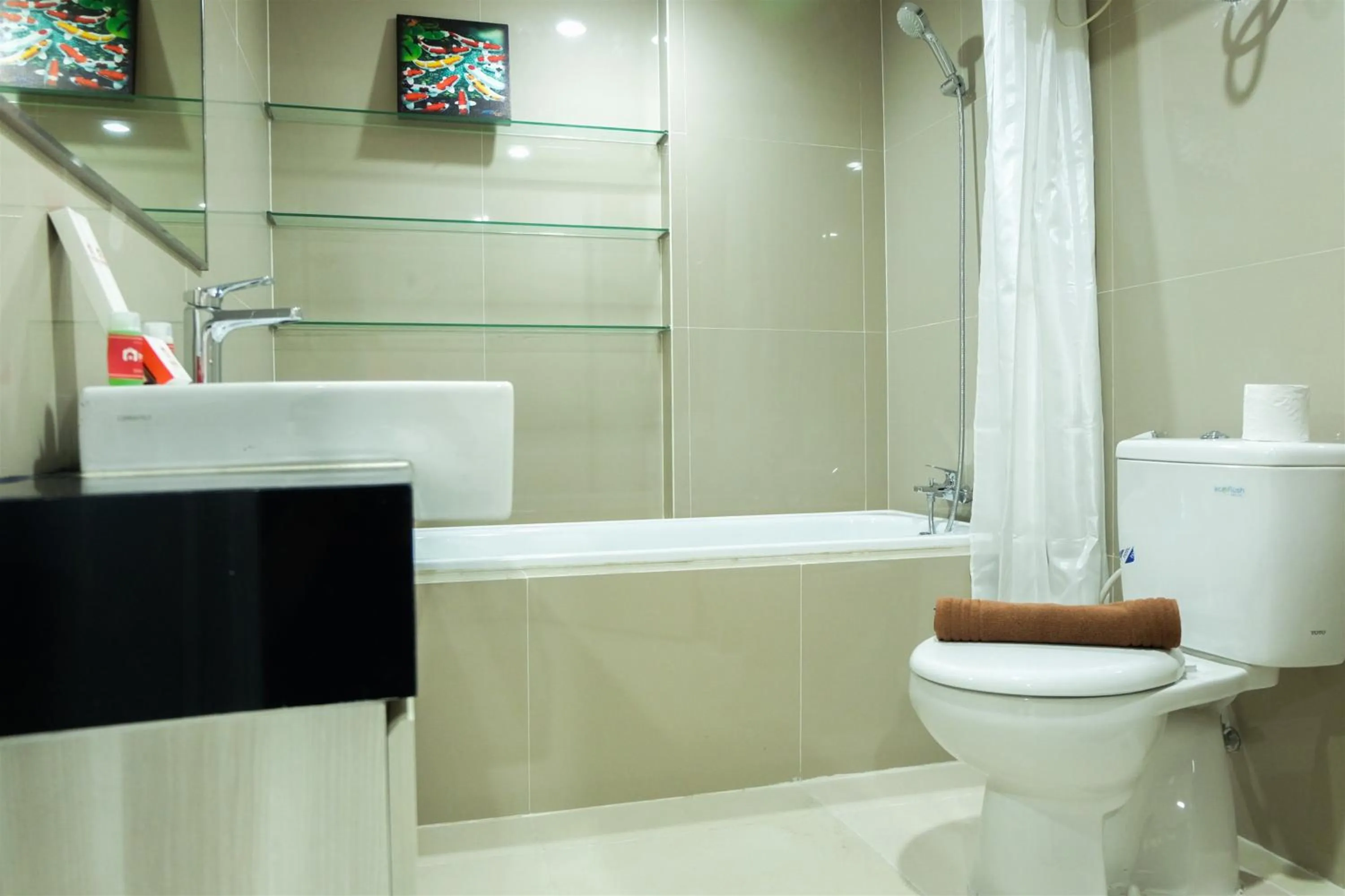 Bathroom in Studio Room Azalea Suites Apartment By Travelio