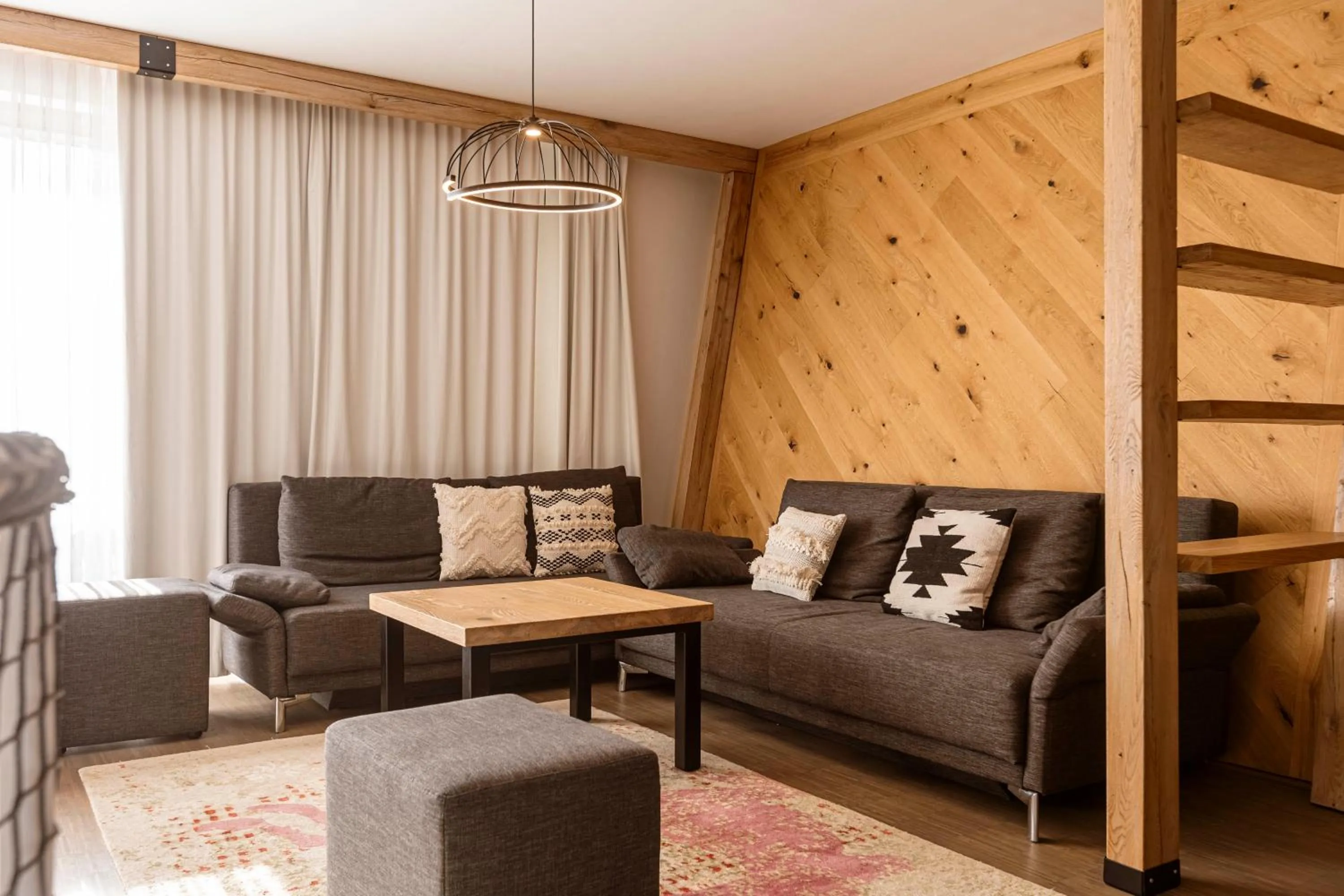 Living room in Alpenrock Schladming by ALPS RESORTS