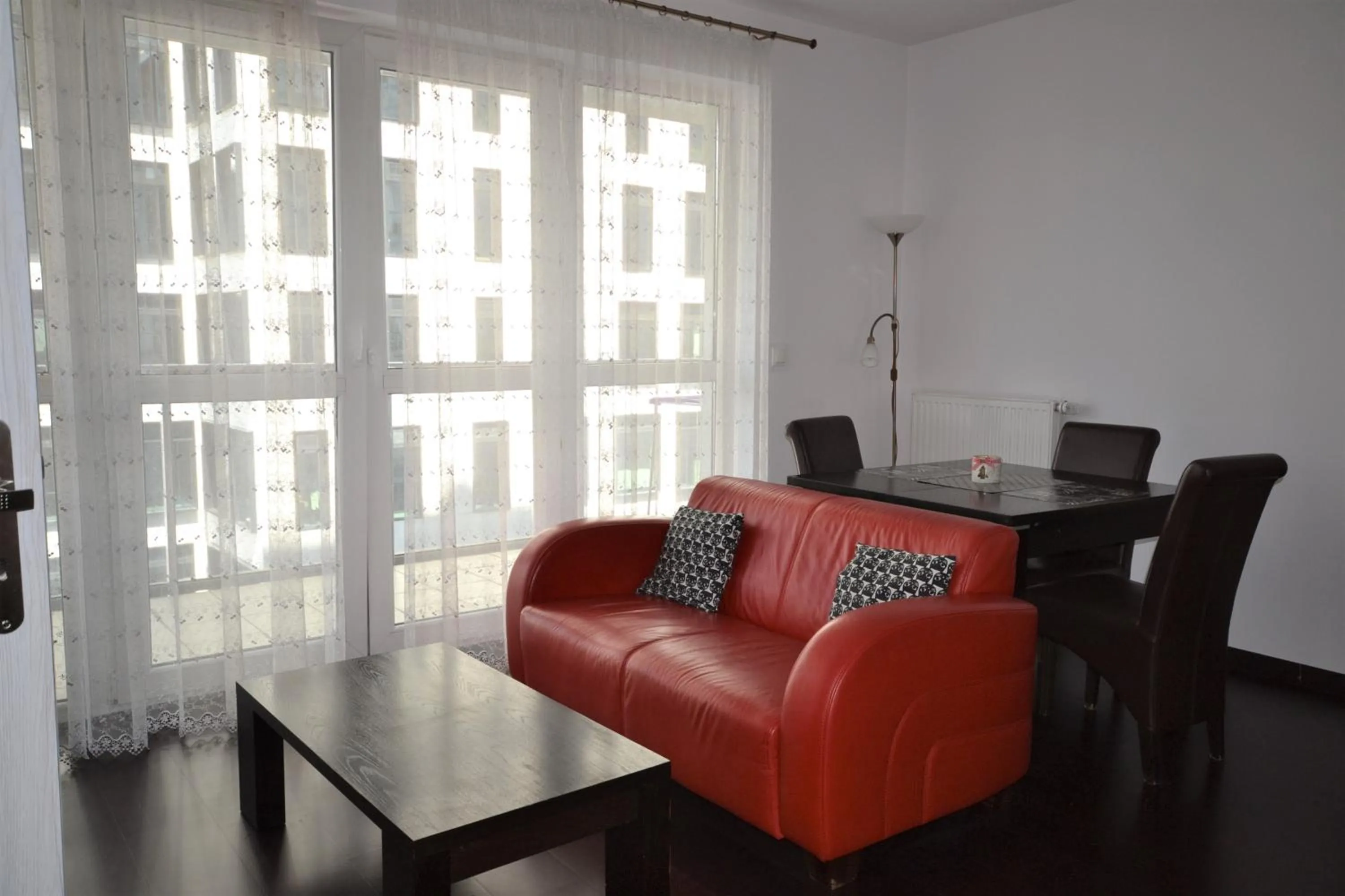 Living room, Seating Area in NotaBene Wola Apartment