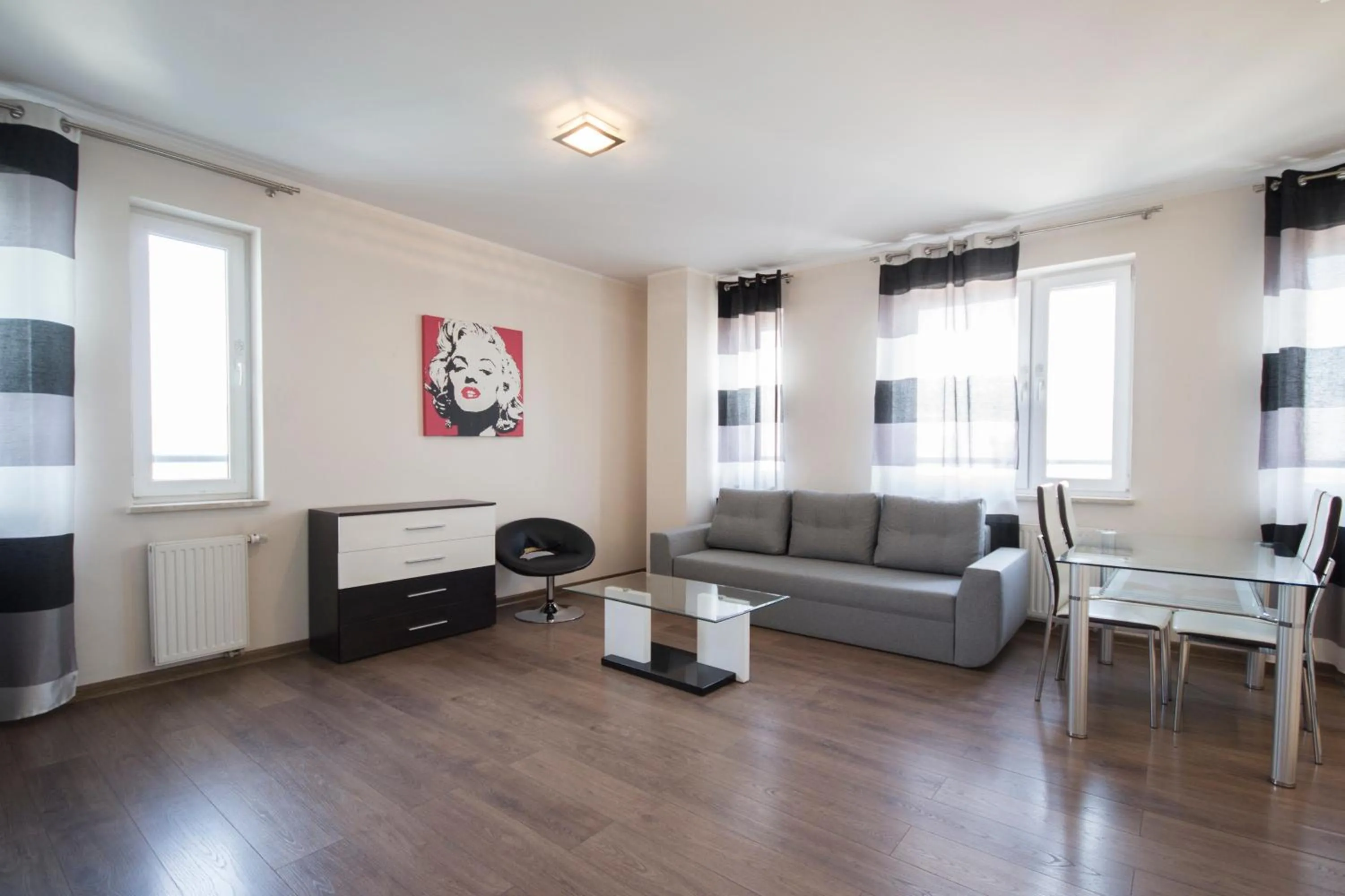 Living room, Seating Area in NotaBene Wola Apartment