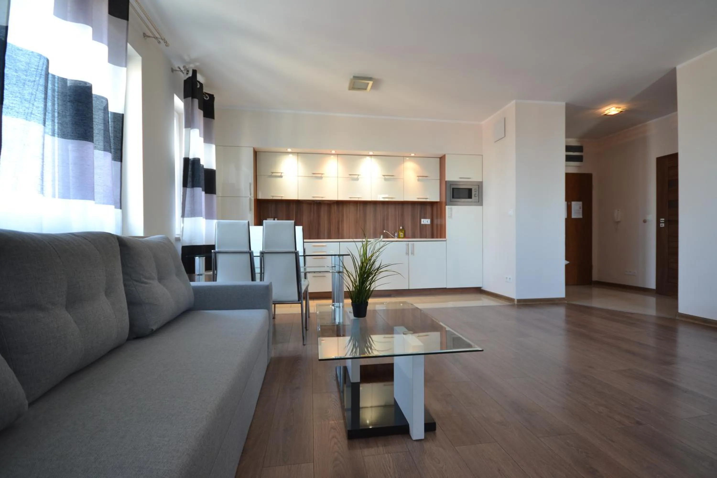 Living room, Seating Area in NotaBene Wola Apartment