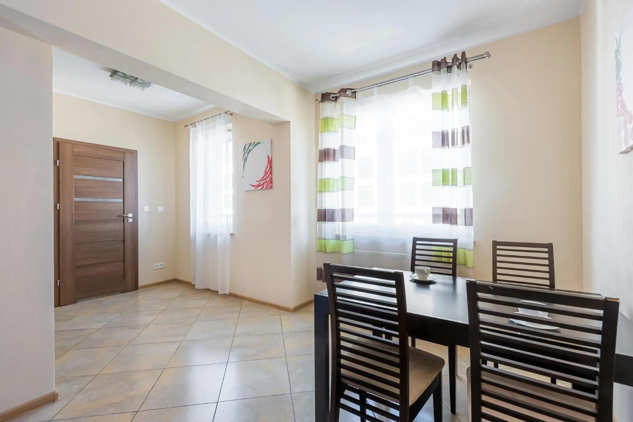 Dining Area in NotaBene Wola Apartment