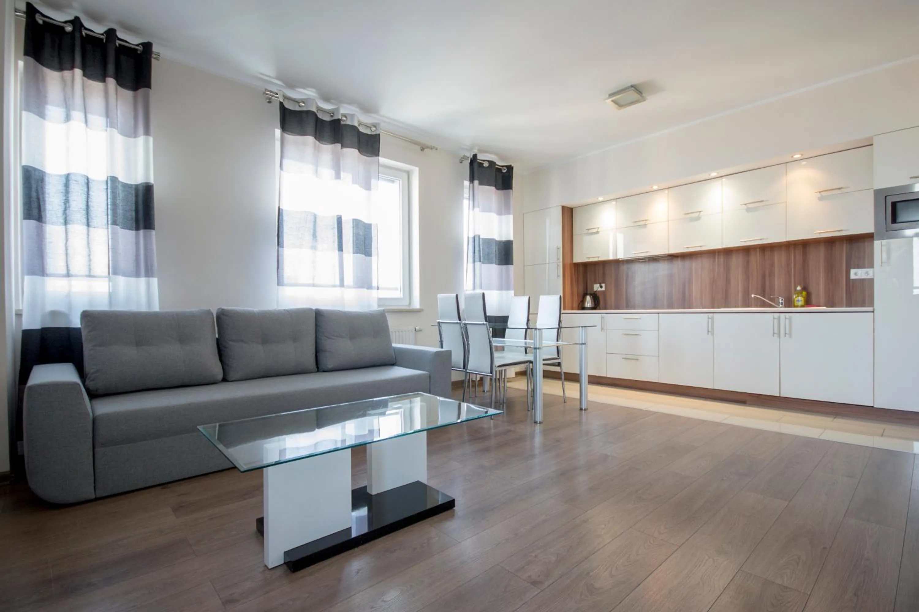 Living room, Seating Area in NotaBene Wola Apartment