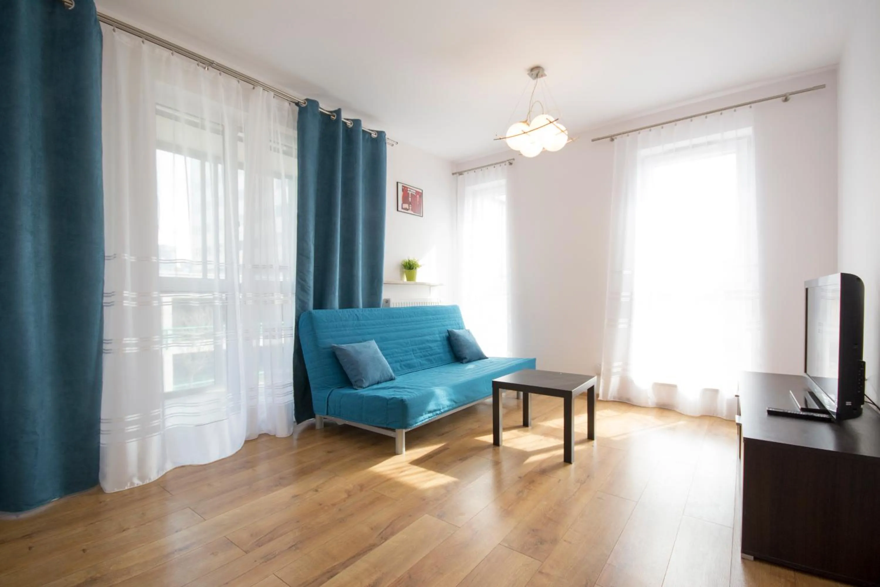 Living room, Seating Area in NotaBene Wola Apartment