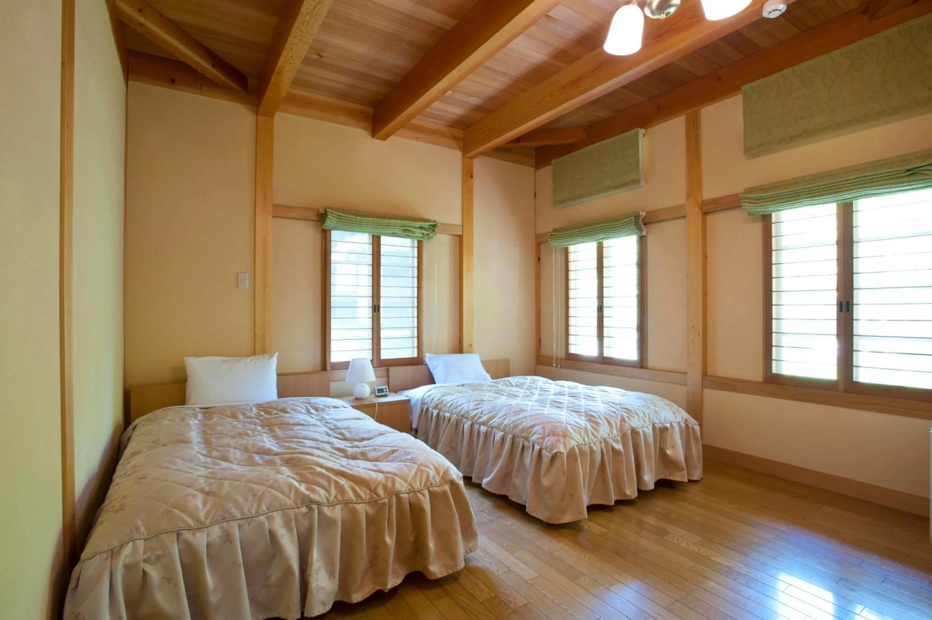 Bed in Takayama Wan Wan Paradise Hotel & Cottage