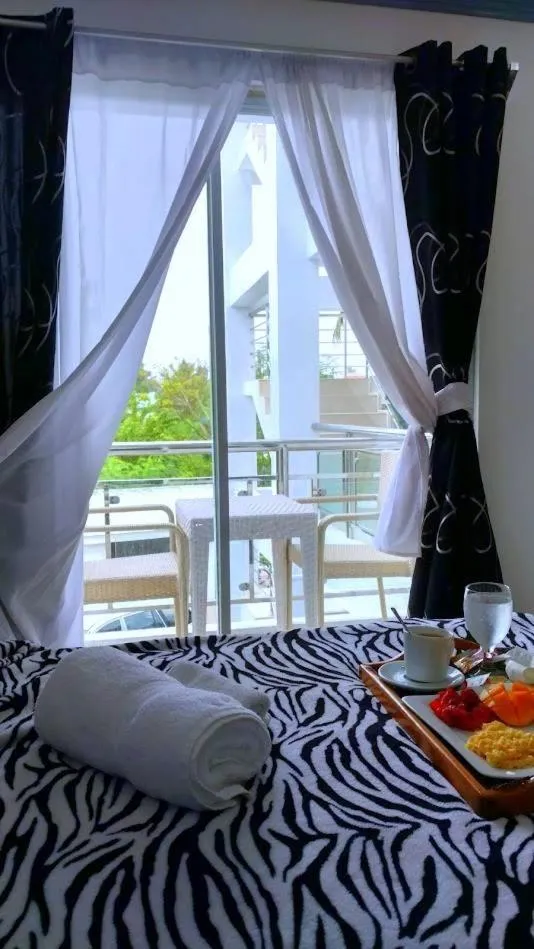 View (from property/room), Bed in Bohol South Beach Hotel