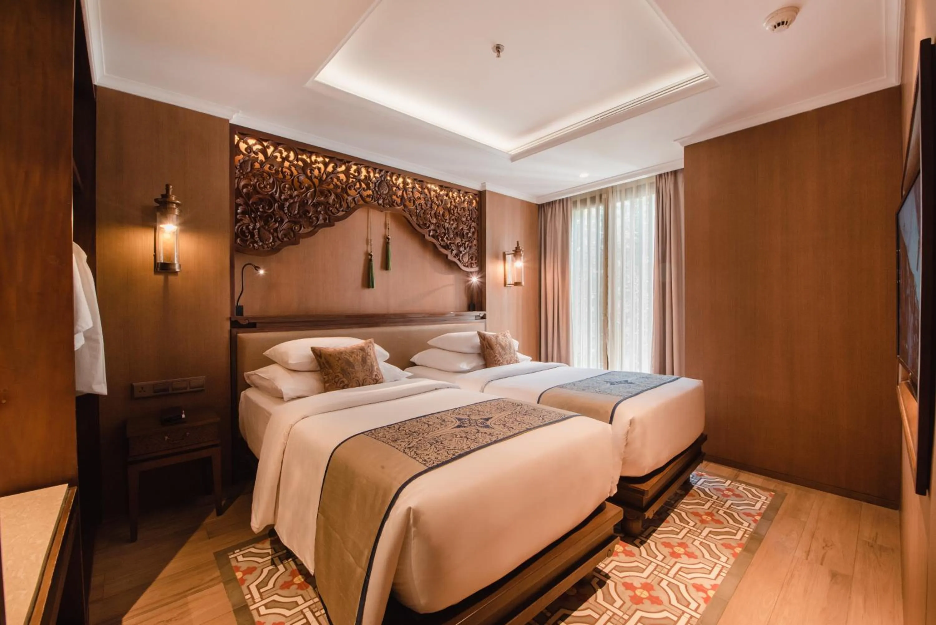 Bed in Ramayana Suites and Resort