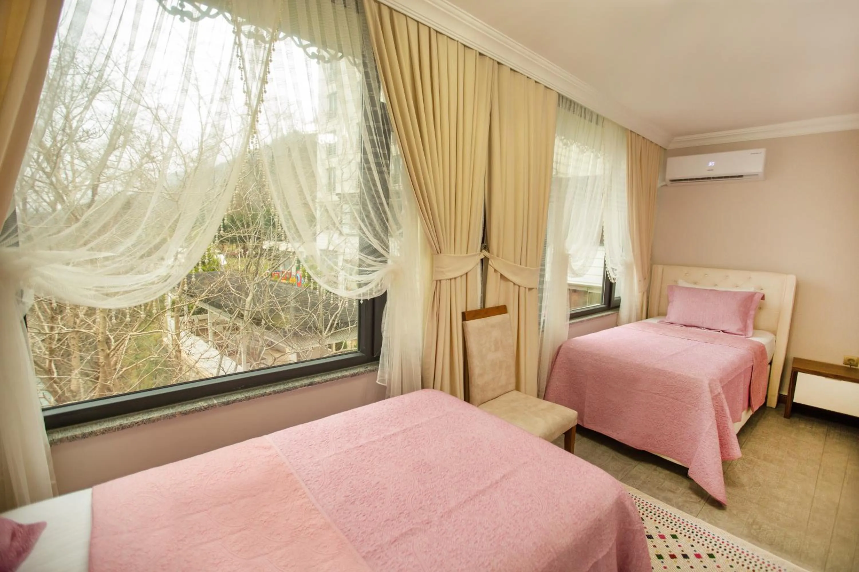 Bedroom in Jolnar garden hotel
